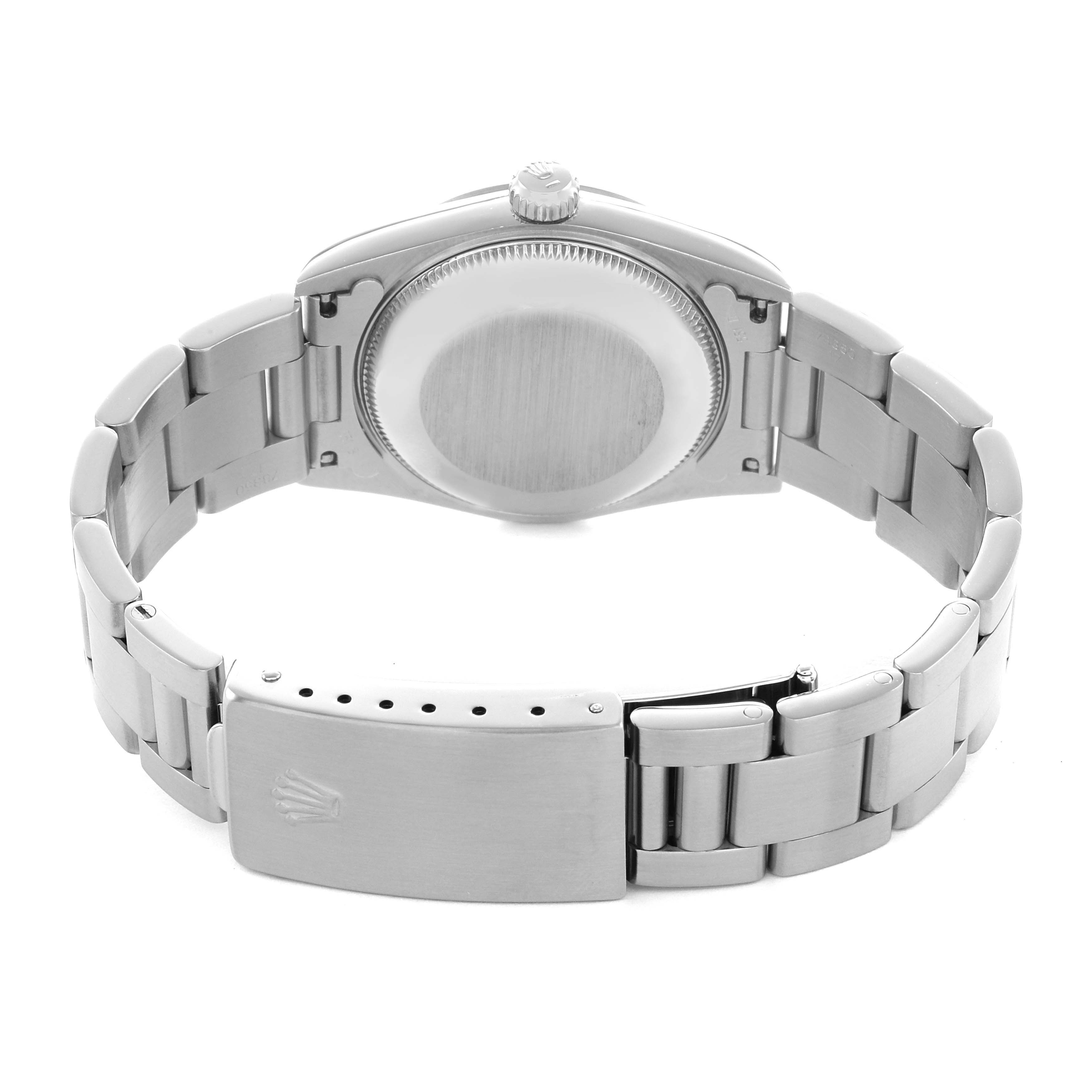 The image shows the back view of a Rolex Mid-Size 67480 Women's Stainless Steel Blue Dial watch, highlighting the case back, clasp, and bracelet.