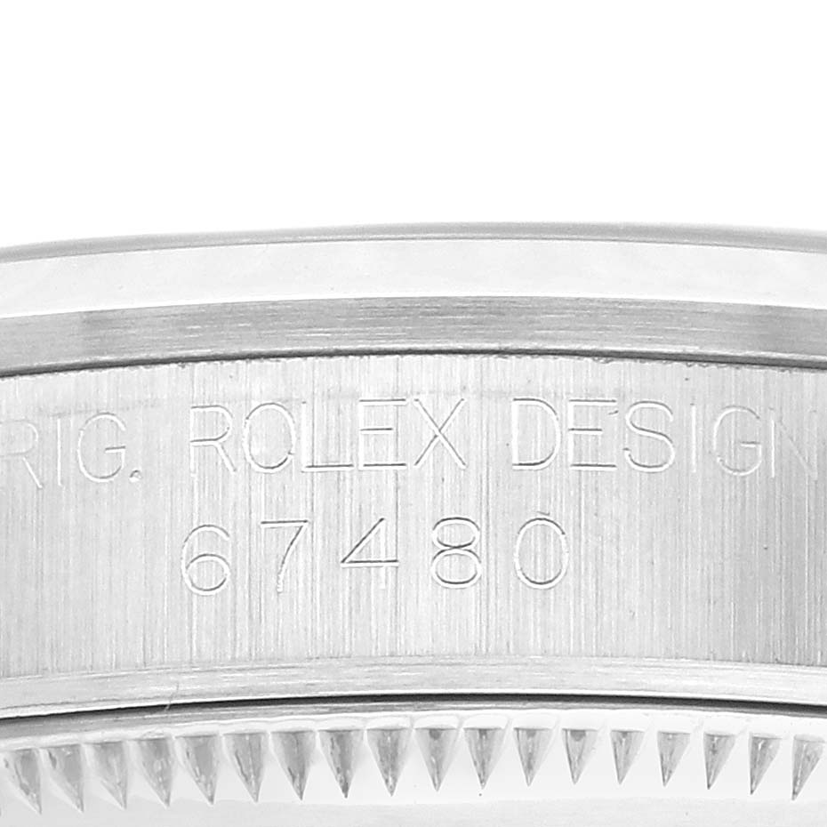 The image shows the side view of a Rolex mid-size watch case with etched model number "67480."