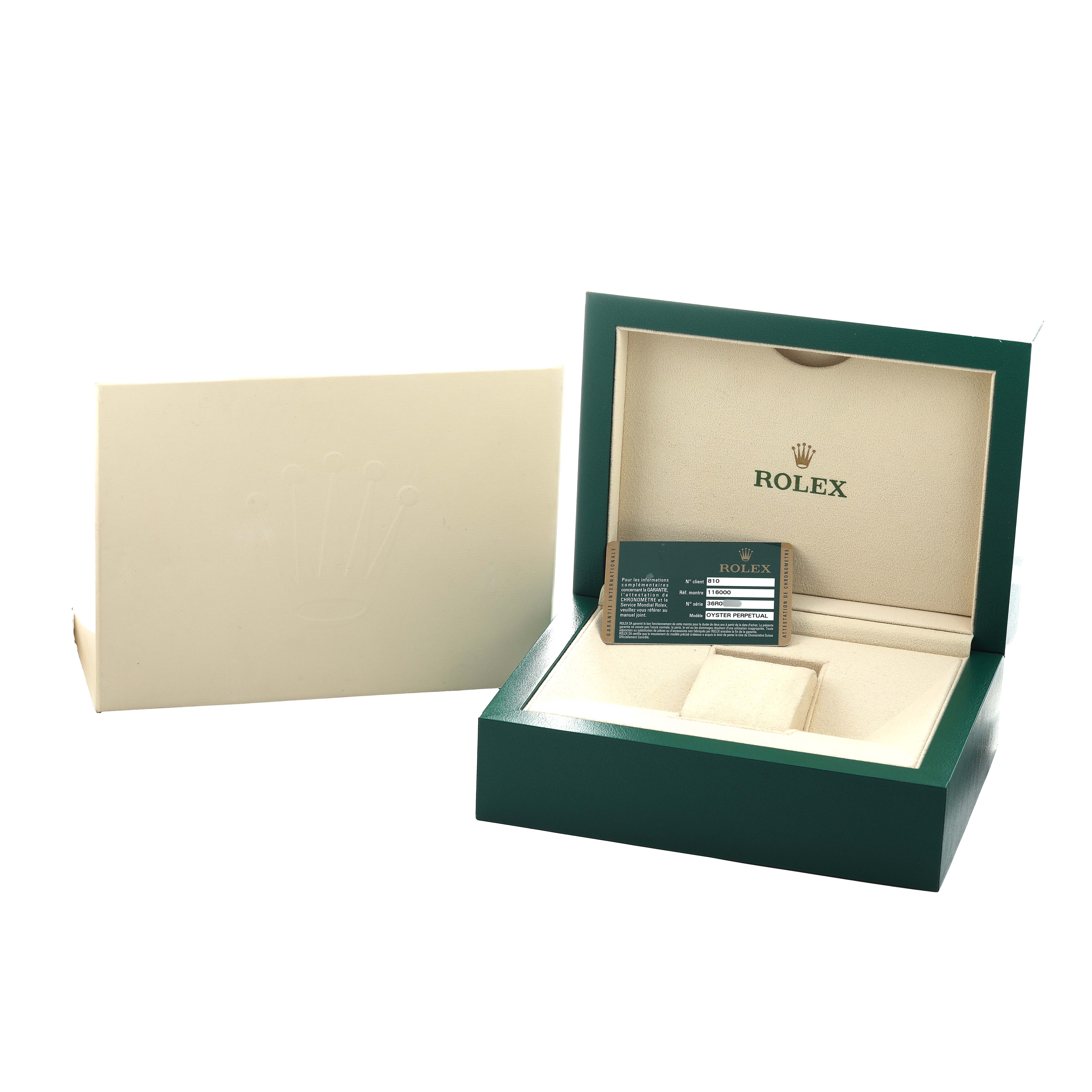 The image shows the packaging for a Rolex Oyster Perpetual 116000 Men's Stainless Steel Purple Dial, including a green box and card inside the open watch case.