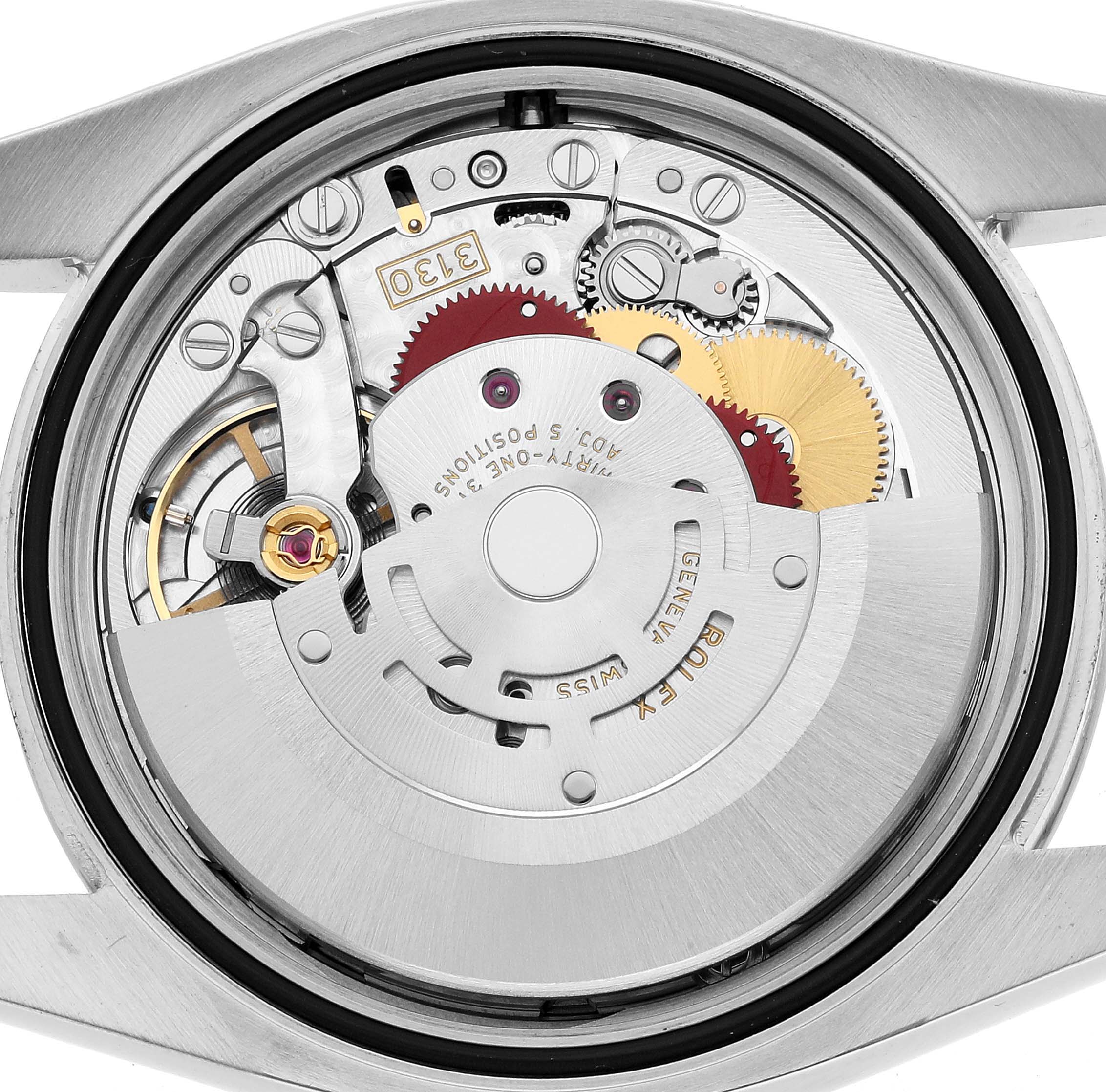 The image shows the movement of a Rolex Oyster Perpetual 116000 Men's Stainless Steel Purple Dial watch from a top-down angle, highlighting its intricate gears and components.