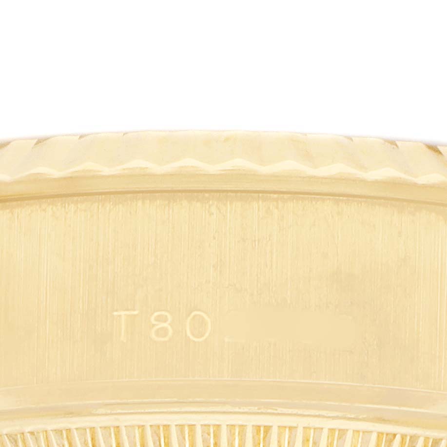 The image shows a close-up of the bezel and case edge of a Rolex President 69178 Women's Yellow Gold White Dial model watch.