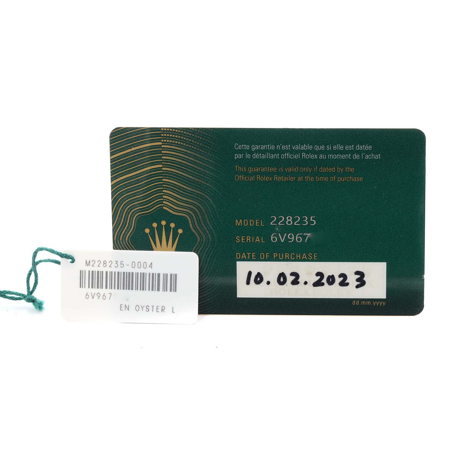 The image shows the guarantee card and tag for the Rolex President 228235-004 Men's Rose Gold Silver Dial 228235-004 Men's Rose Gold Silver Dial model watch, highlighting model and serial numbers.