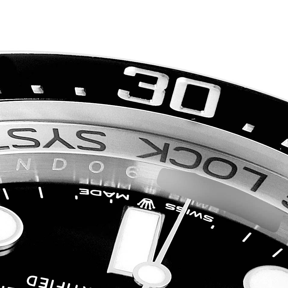 This close-up angle shows the bezel and part of the dial of the Rolex Sea-Dweller 126660 Men's Stainless Steel Blue Dial 126660 Men's Stainless Steel Blue Dial watch, including the "LOCK" system marking and minute indicators.