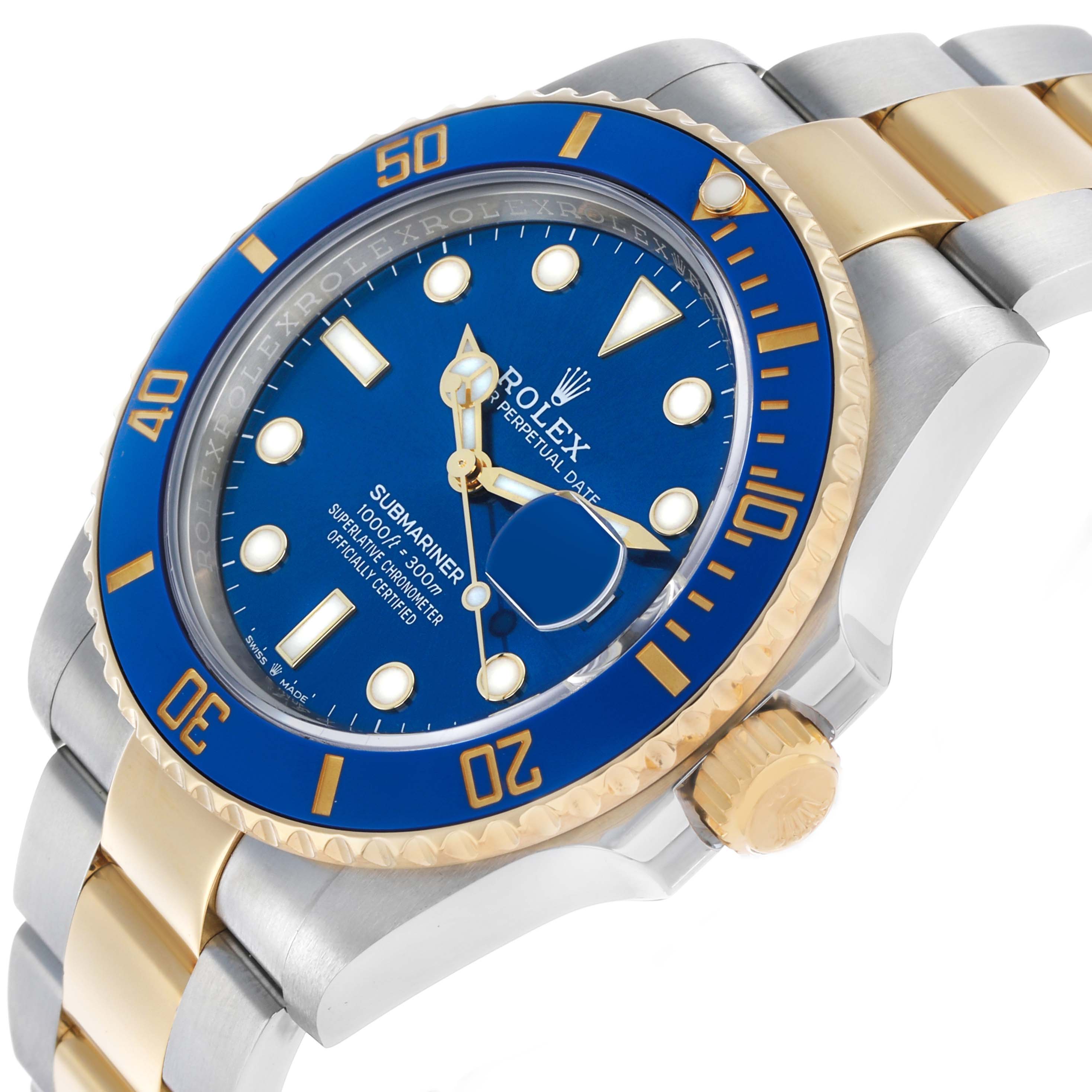 The Rolex Submariner 126613 Men's Steel and Gold (two tone) Blue Dial watch is shown at a three-quarter angle, highlighting the face, bezel, crown, and bracelet.