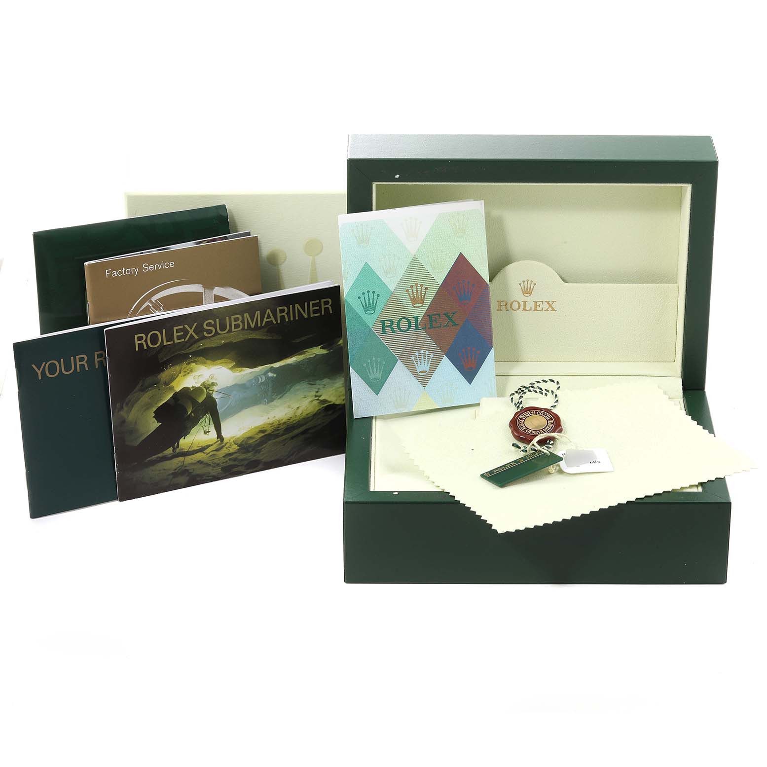 This image shows the packaging, manuals, warranty card, cleaning cloth, and a keychain for the Rolex Submariner 16613 Men's Steel and Gold (two tone) Blue Dial 16613 Men's Steel and Gold (two tone) Blue Dial.