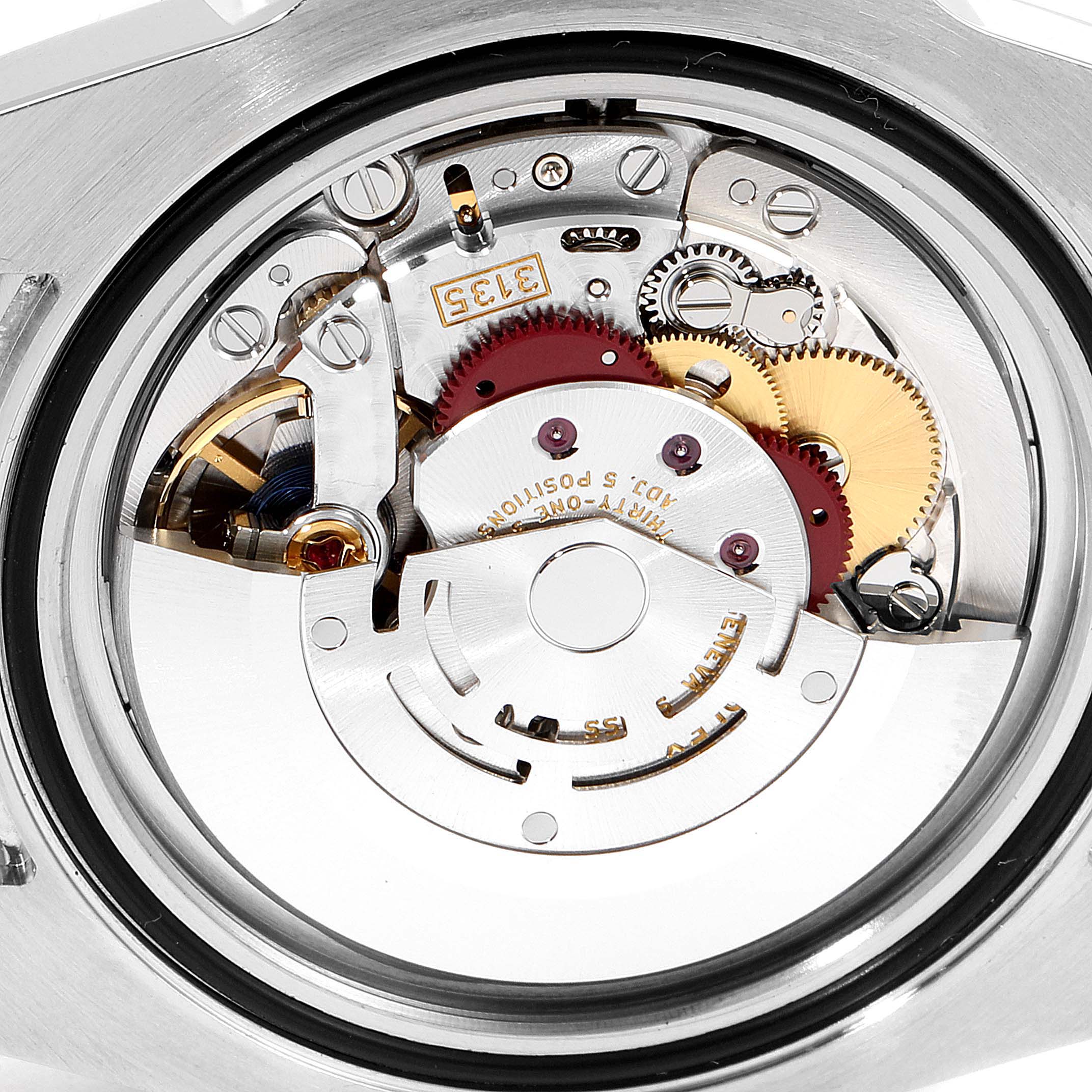 This image shows the intricate internal mechanism of a Rolex Submariner 116613 Men's Steel and Gold (two tone) Black Dial 116613 Men's Steel and Gold (two tone) Black Dial watch at a close-up angle.