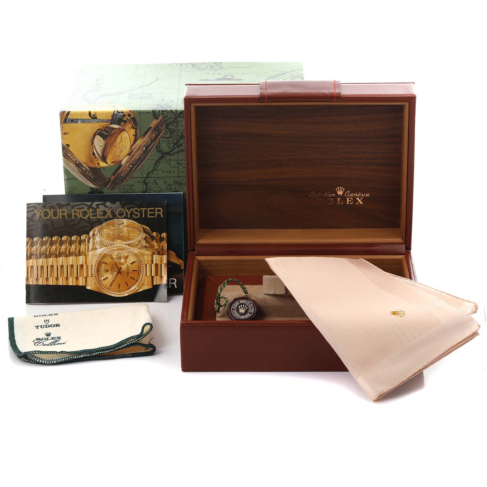 The image shows the Rolex Submariner 16618 Men's Yellow Gold Blue Dial 16618 Men's Yellow Gold Blue Dial's box, manuals, a tag, and a cloth, viewed from a front angle.