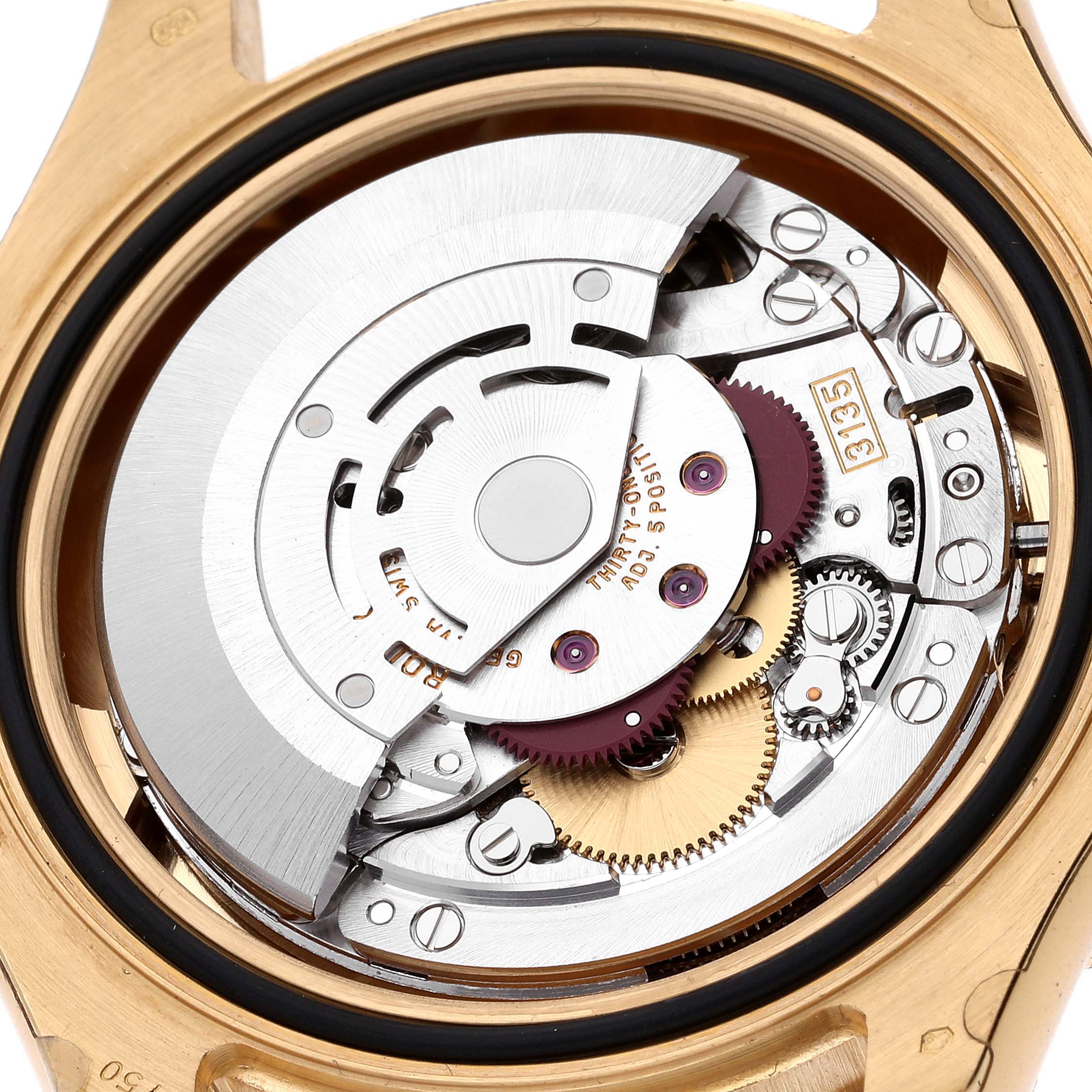 This is an inside view of the Rolex Yacht-Master 16628 Men's Yellow Gold Blue Dial 16628 Men's Yellow Gold Blue Dial watch, showing its intricate automatic movement parts.