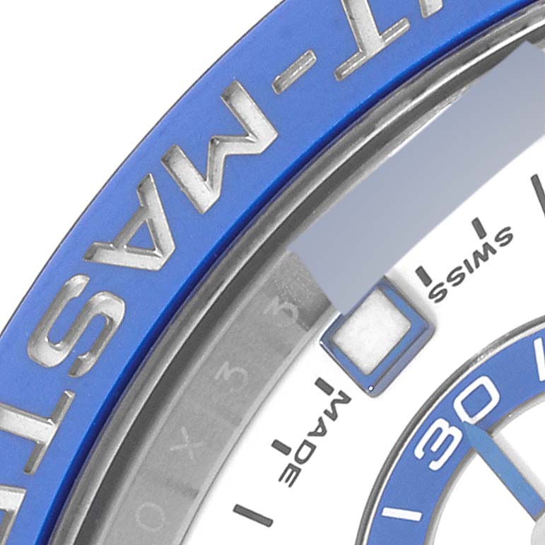 The image shows a close-up of a Rolex Yacht-Master 116680 Men's Stainless Steel White Dial 116680 Men's Stainless Steel White Dial watch, highlighting part of the bezel and the "Swiss Made" text on the dial.