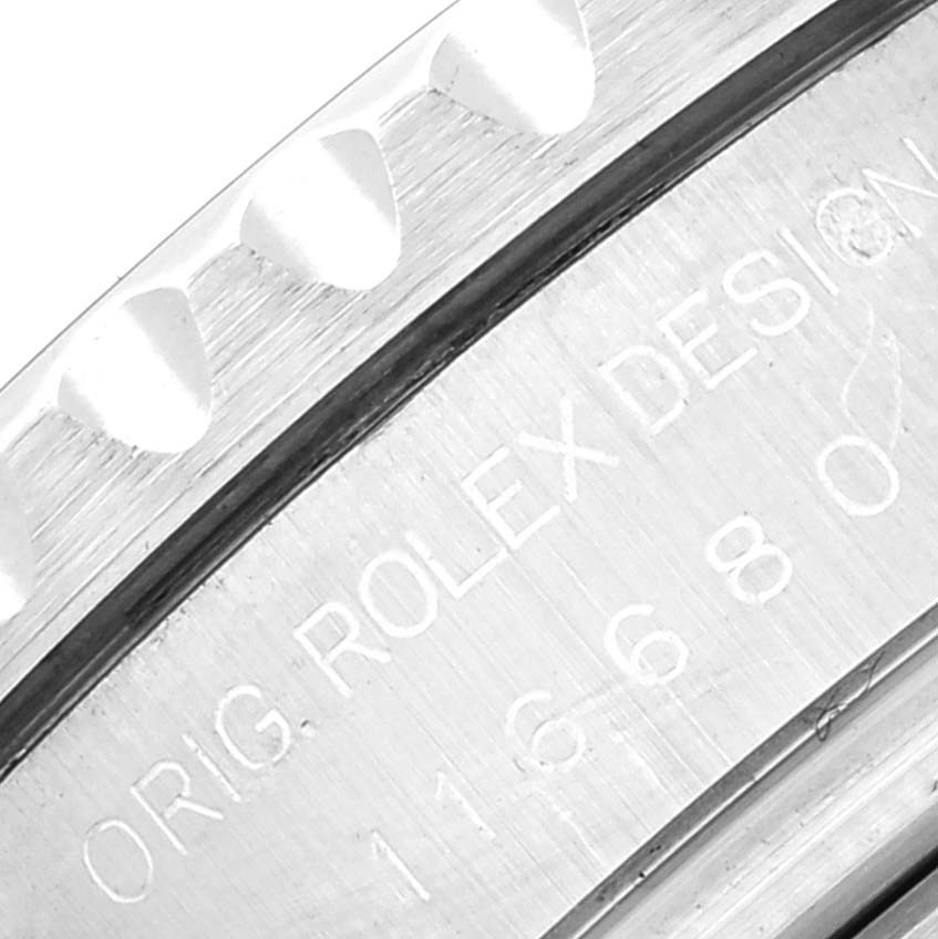 This close-up shows the etched details and part of the bezel of a Rolex Yacht-Master 116680 Men's Stainless Steel White Dial 116680 Men's Stainless Steel White Dial watch.