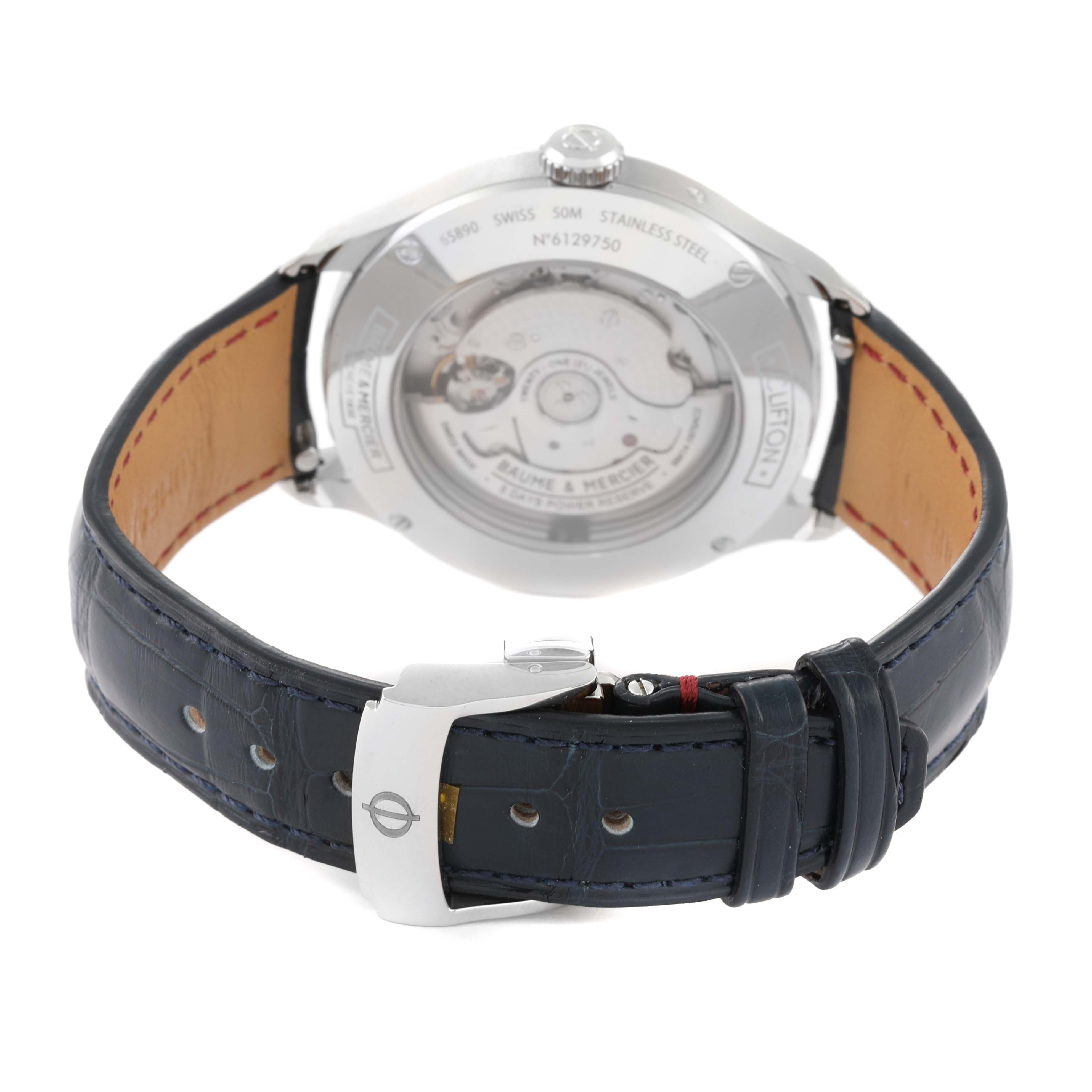 The image shows the back view of a Baume 
Mercier Clifton M0A10548 Men
s Stainless Steel Grey Dial M0A10548 Men
s Stainless Steel Grey Dial watch, highlighting the movement and leather strap.