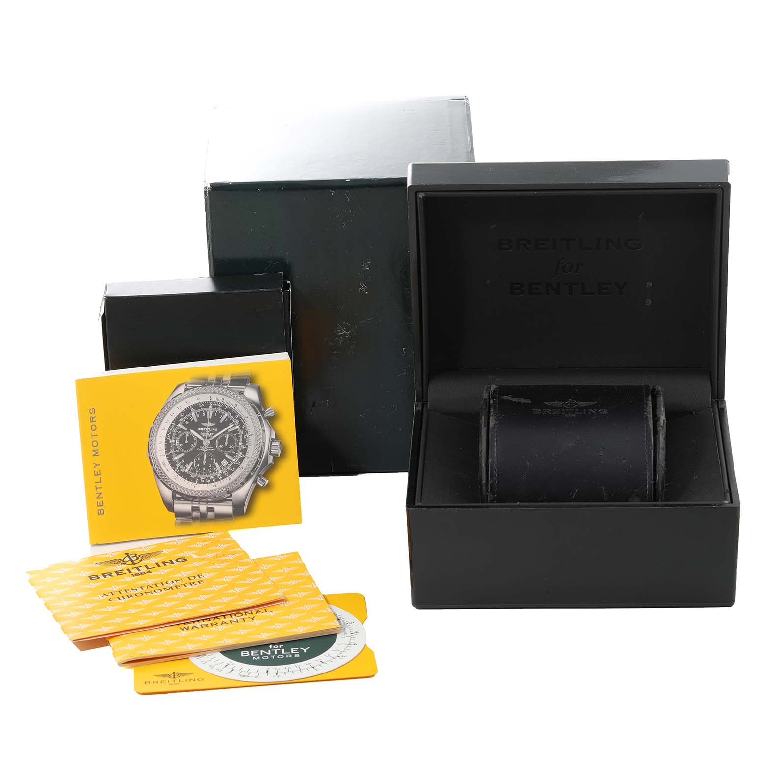 The image shows a Breitling for Bentley watch box with booklets and warranty cards at an angle.