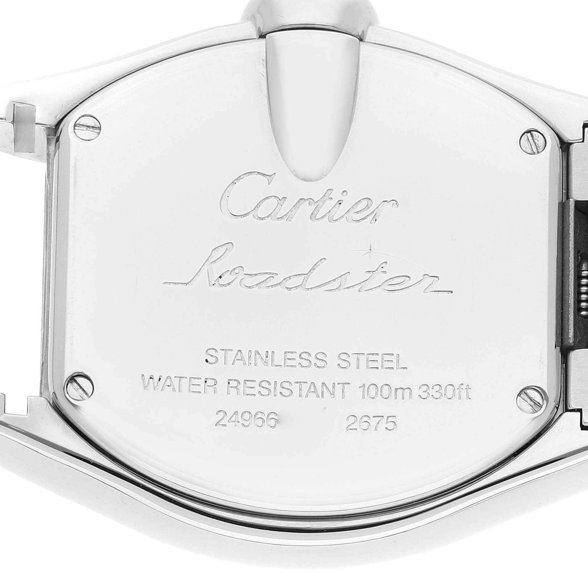 The image shows the stainless steel back case of a Cartier Roadster W62017V3 Women's Stainless Steel Pink Dial W62017V3 Women's Stainless Steel Pink Dial watch, detailing its water resistance and serial numbers.