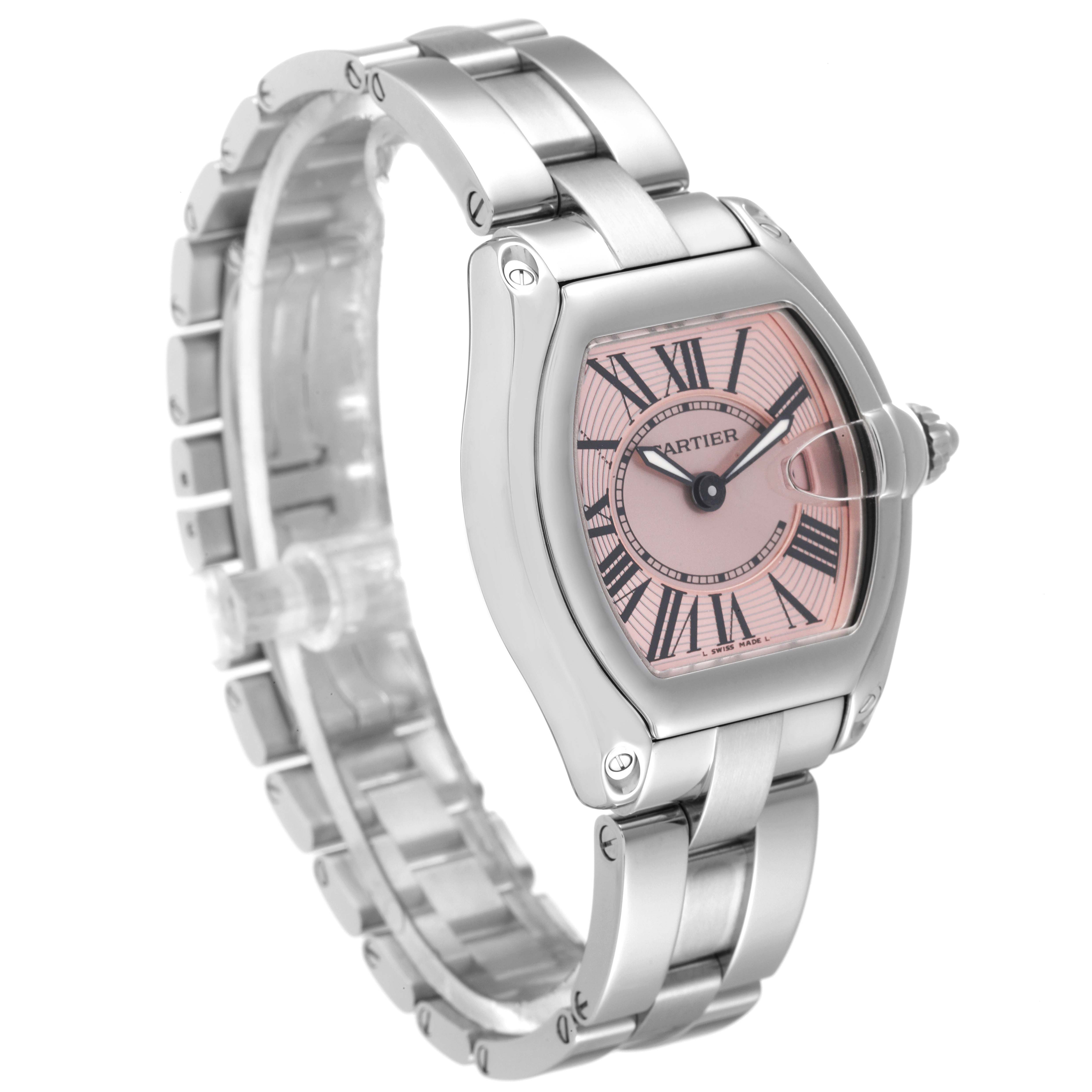 The image shows a Cartier Roadster W62017V3 Women's Stainless Steel Pink Dial W62017V3 Women's Stainless Steel Pink Dial watch at a three-quarter angle, highlighting its face, bezel, and part of the metal bracelet.