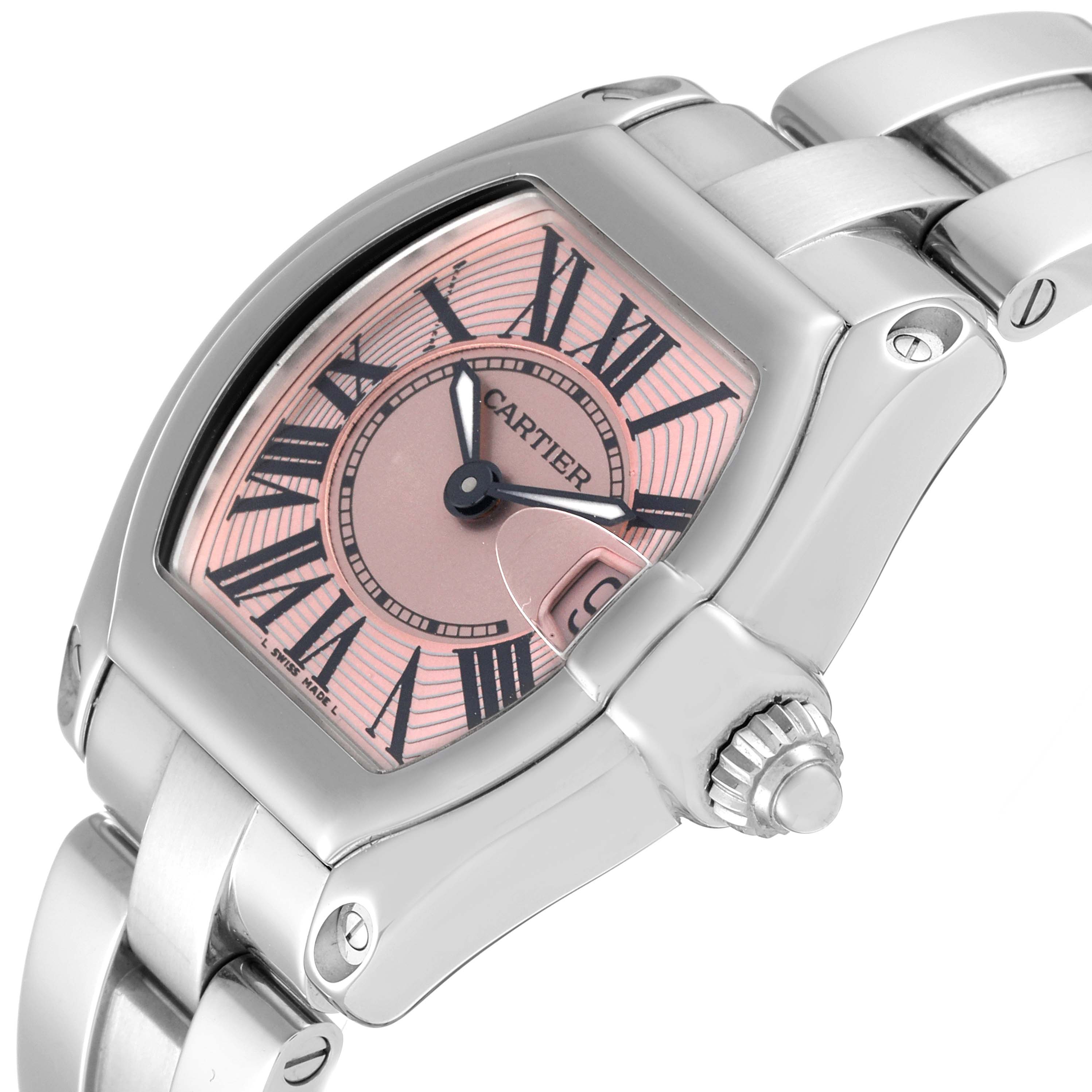 The image shows a Cartier Roadster W62017V3 Women's Stainless Steel Pink Dial W62017V3 Women's Stainless Steel Pink Dial watch at a tilted angle, highlighting its face, crown, and part of the bracelet.