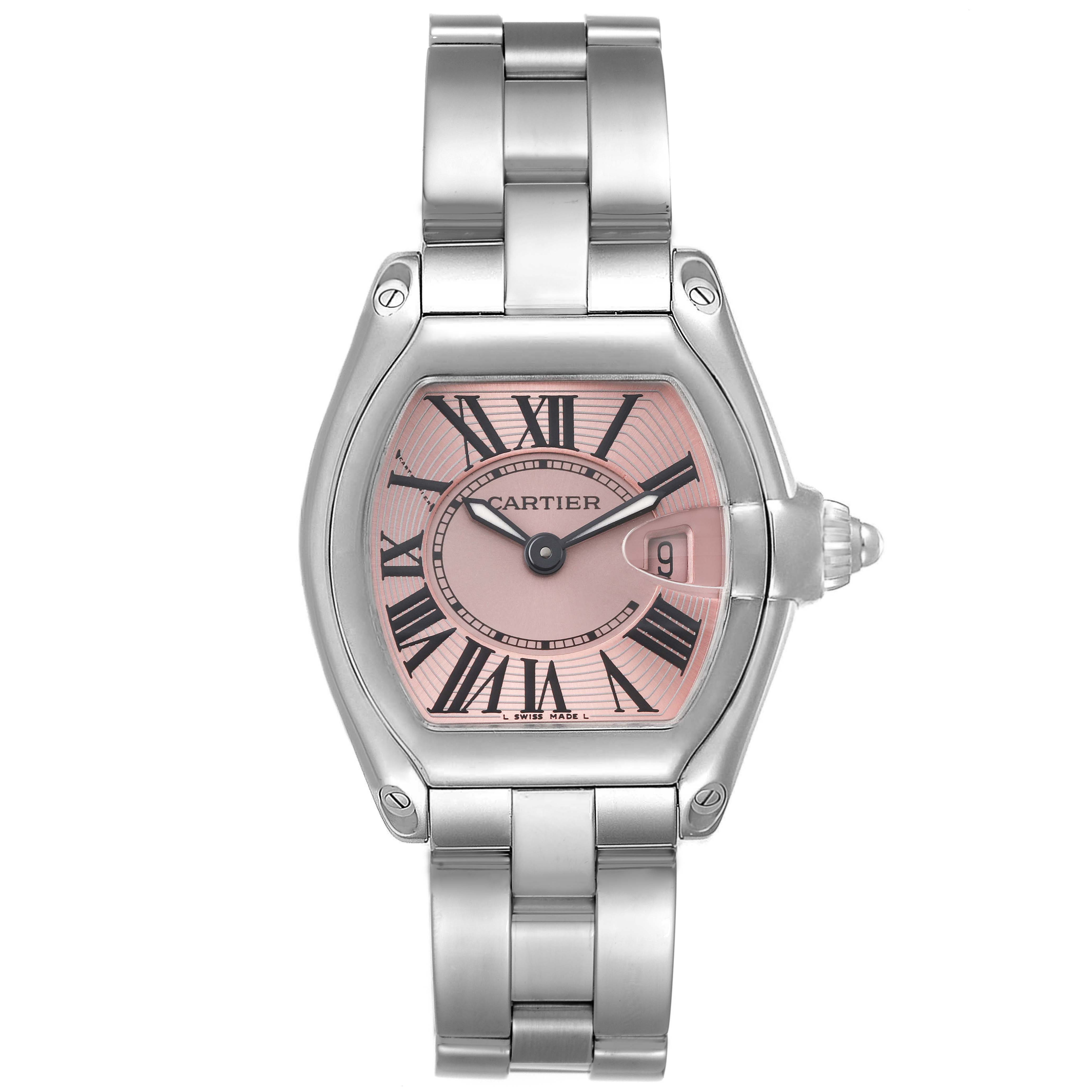 The image shows a front view of a Cartier Roadster W62017V3 Women's Stainless Steel Pink Dial W62017V3 Women's Stainless Steel Pink Dial watch, highlighting its pink dial, Roman numerals, and stainless steel bracelet.