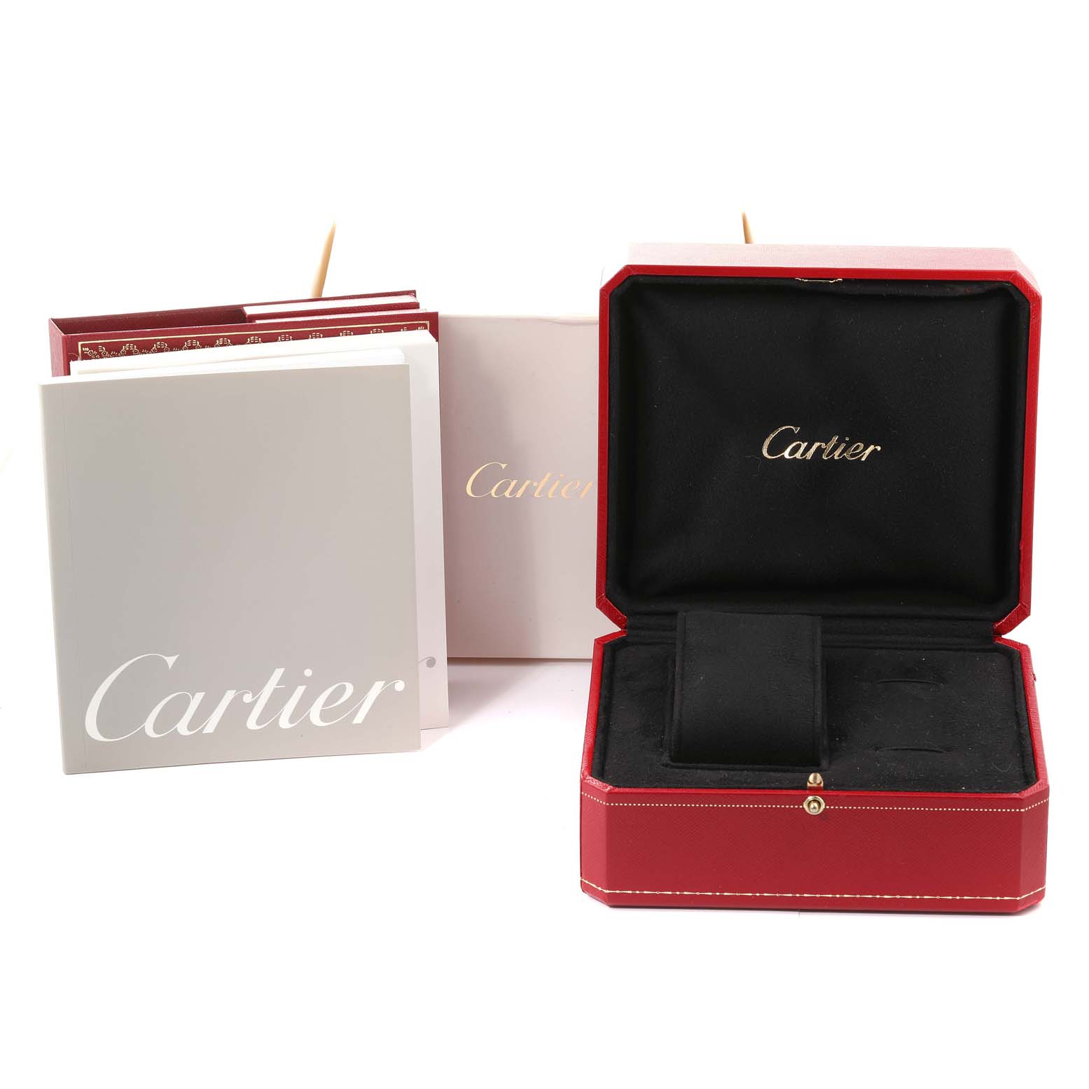 The image shows the packaging and accessories of a Cartier Roadster W62017V3 Women's Stainless Steel Pink Dial W62017V3 Women's Stainless Steel Pink Dial watch, including the inner and outer boxes and a booklet.