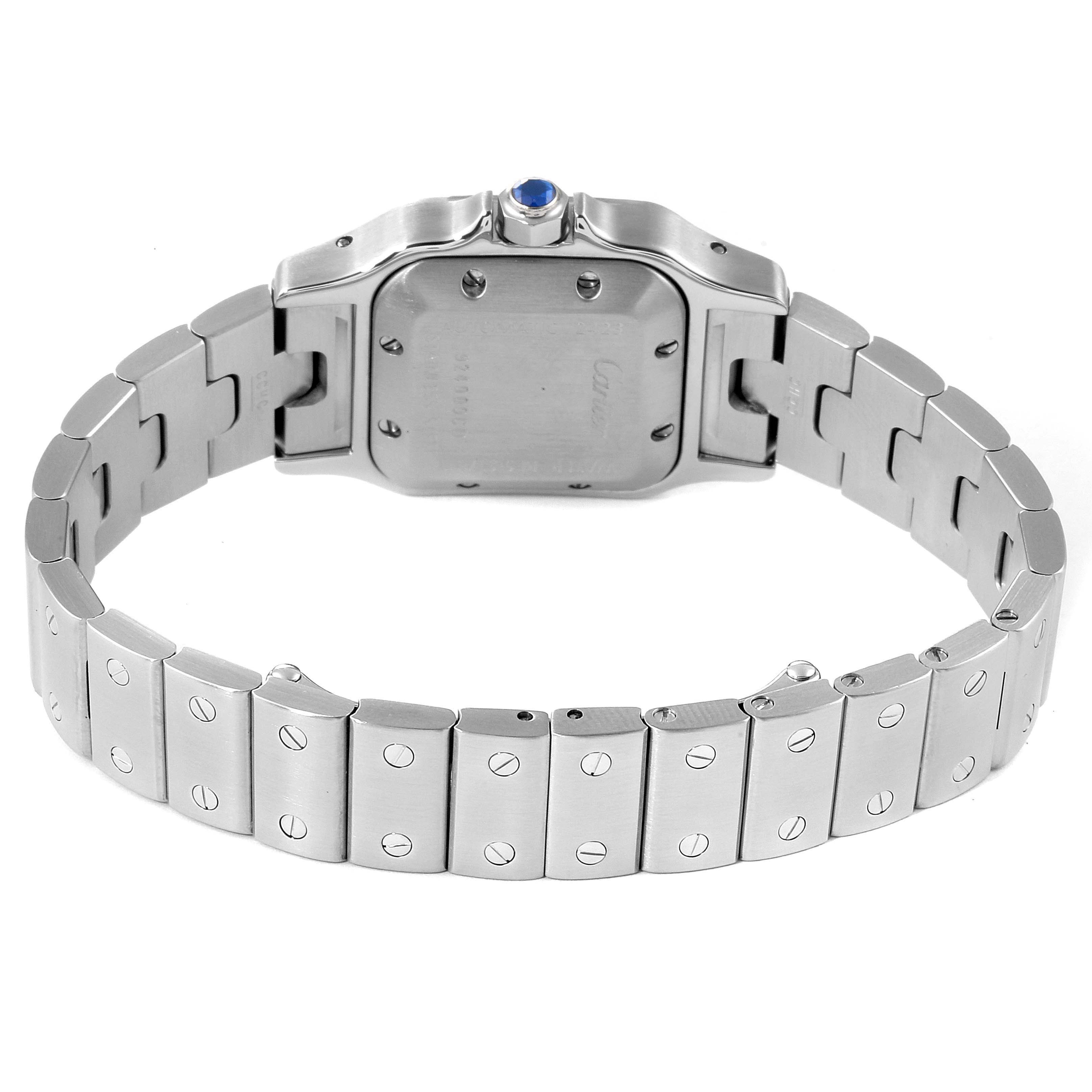 The image shows the backside of a Cartier Santos W20044D6 Women's Stainless Steel Silver Dial W20044D6 Women's Stainless Steel Silver Dial model watch, highlighting its case back, bracelet, and deployment clasp.