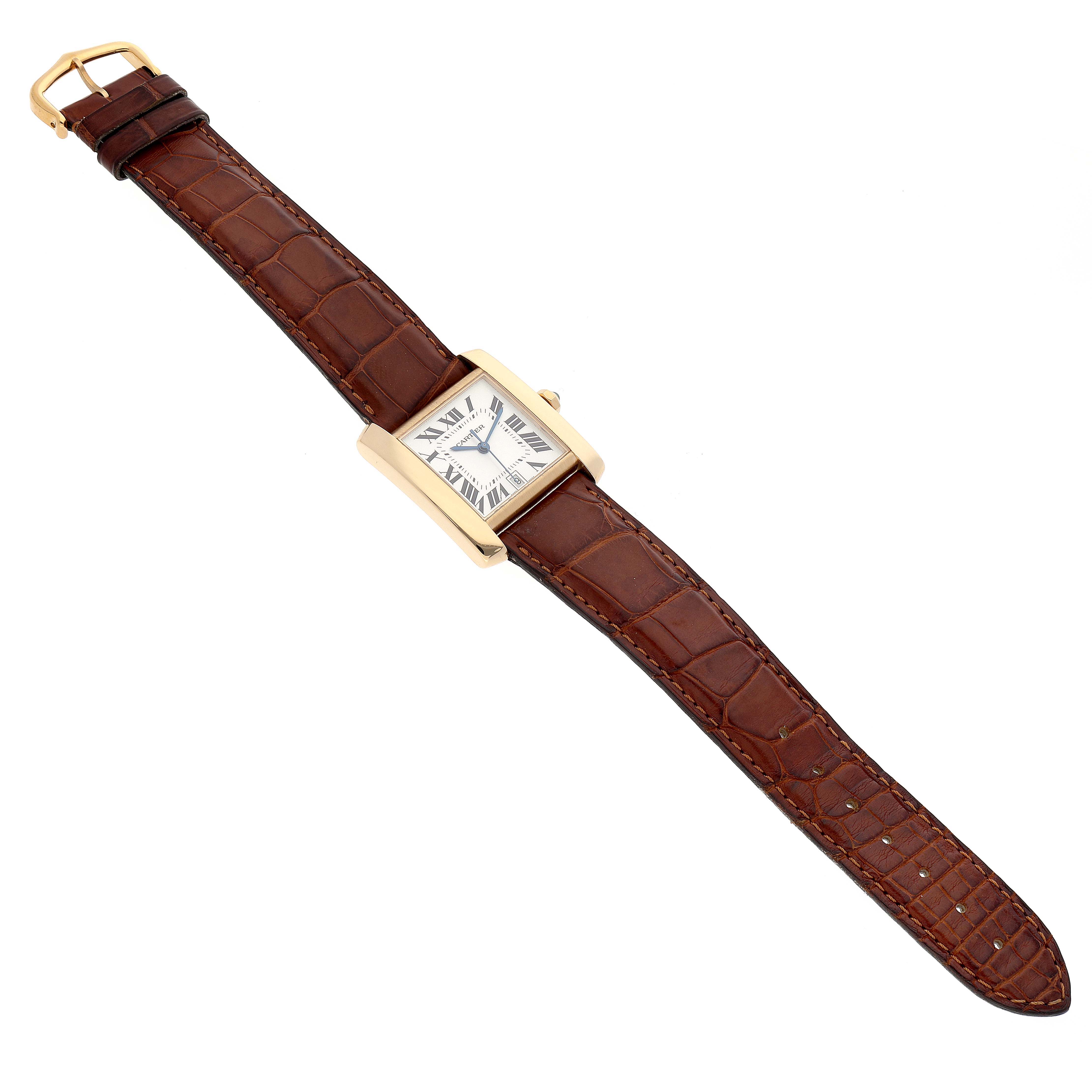 The image shows a Cartier Tank Francaise W5000156 Men's Yellow Gold Silver Dial W5000156 Men's Yellow Gold Silver Dial watch from a top-down angle, highlighting its rectangular face and brown leather strap.