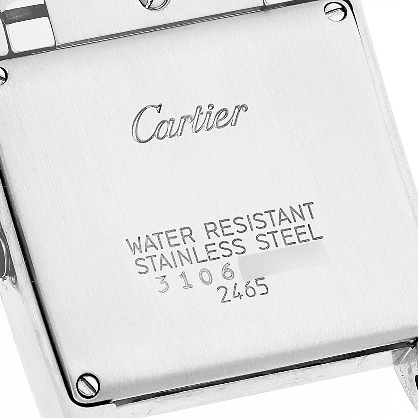 This image shows the back case of the Cartier Tank Française watch with brand and specifications engraved.