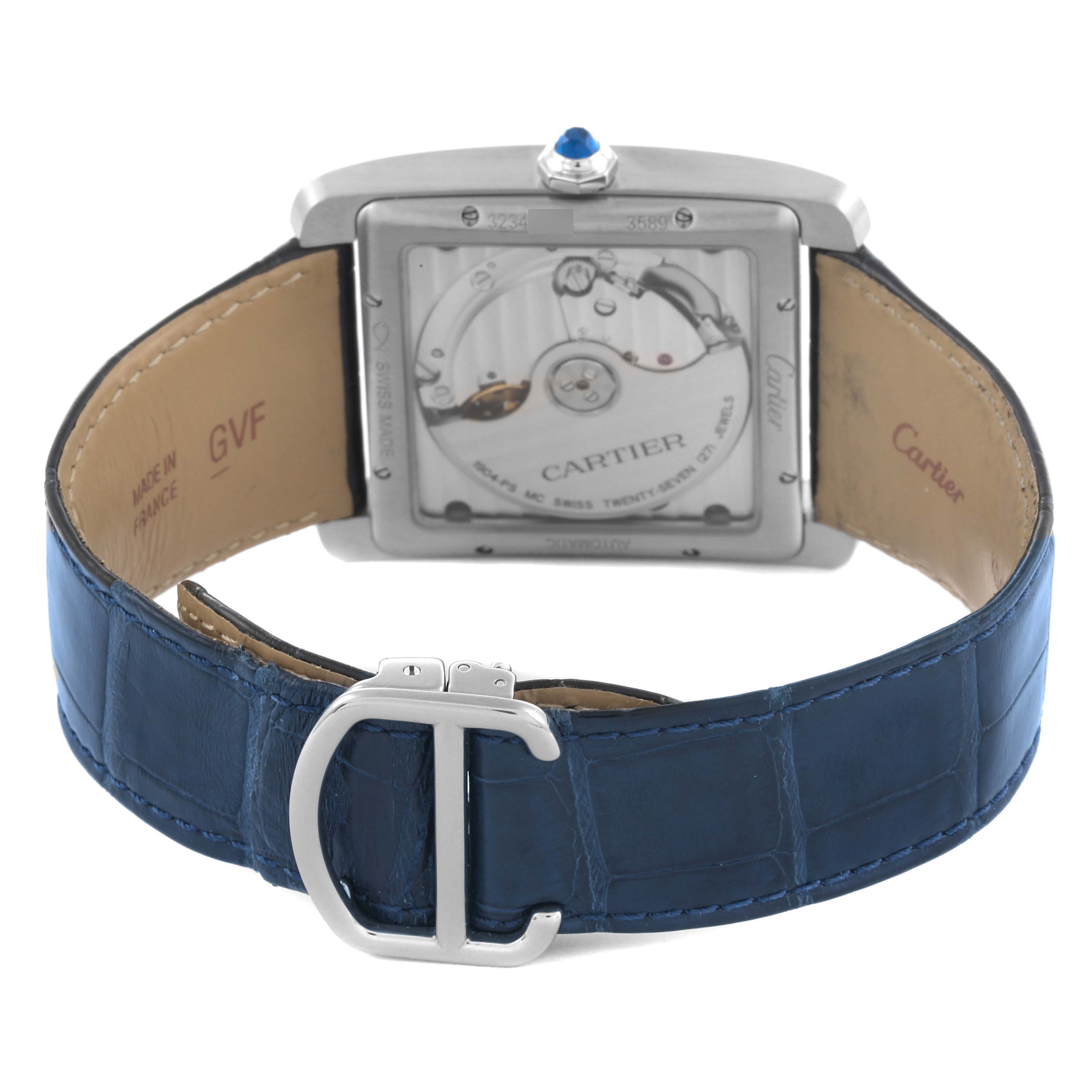 The Cartier Tank MC WSTA0010 Men's Stainless Steel Blue Dial WSTA0010 Men's Stainless Steel Blue Dial watch is shown from the back, highlighting its movement and blue leather strap with a buckle.