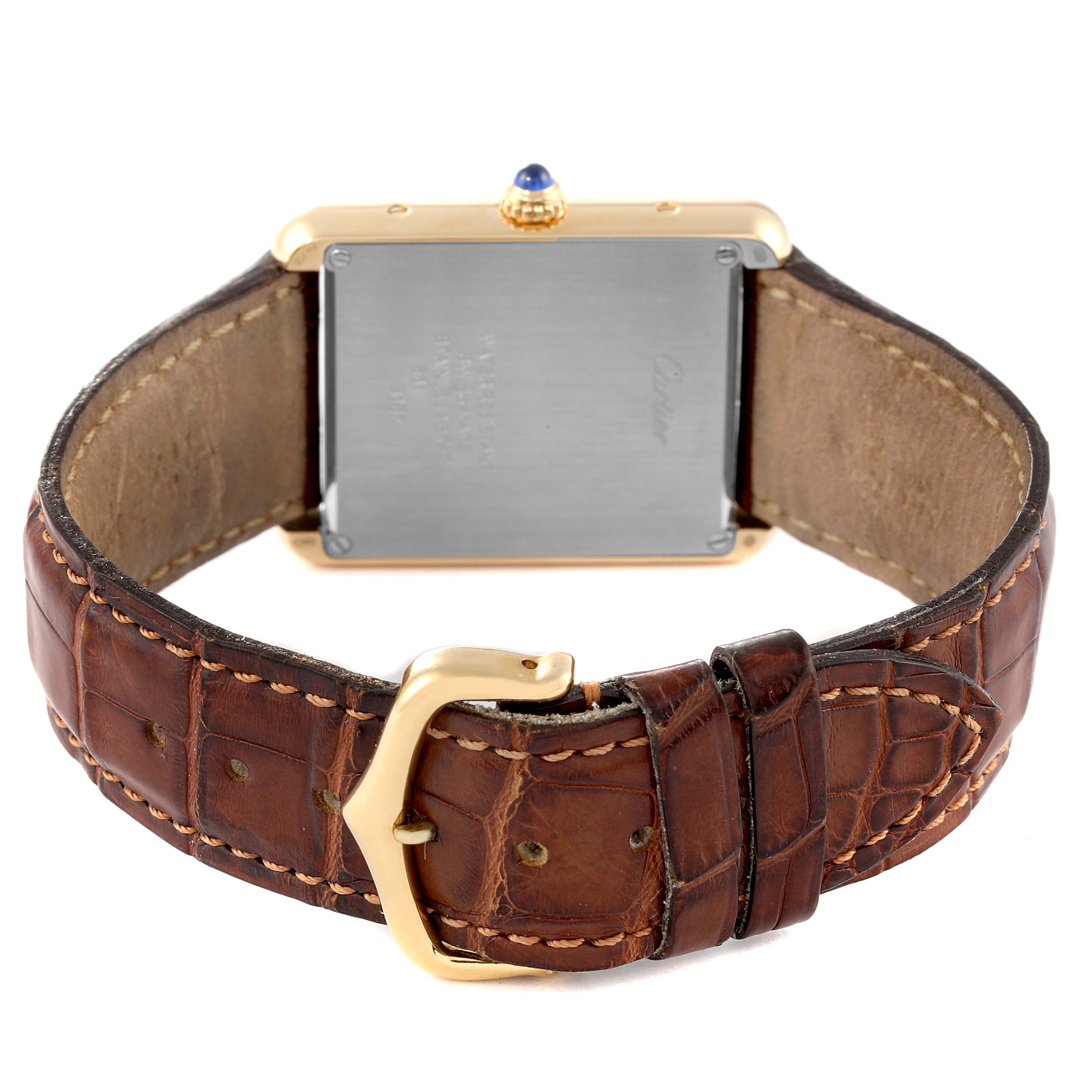 The image shows the back view of a Cartier Tank Solo W5200004 Men's Yellow Gold Silver Dial W5200004 Men's Yellow Gold Silver Dial watch, highlighting the case back, brown leather strap, and gold buckle.