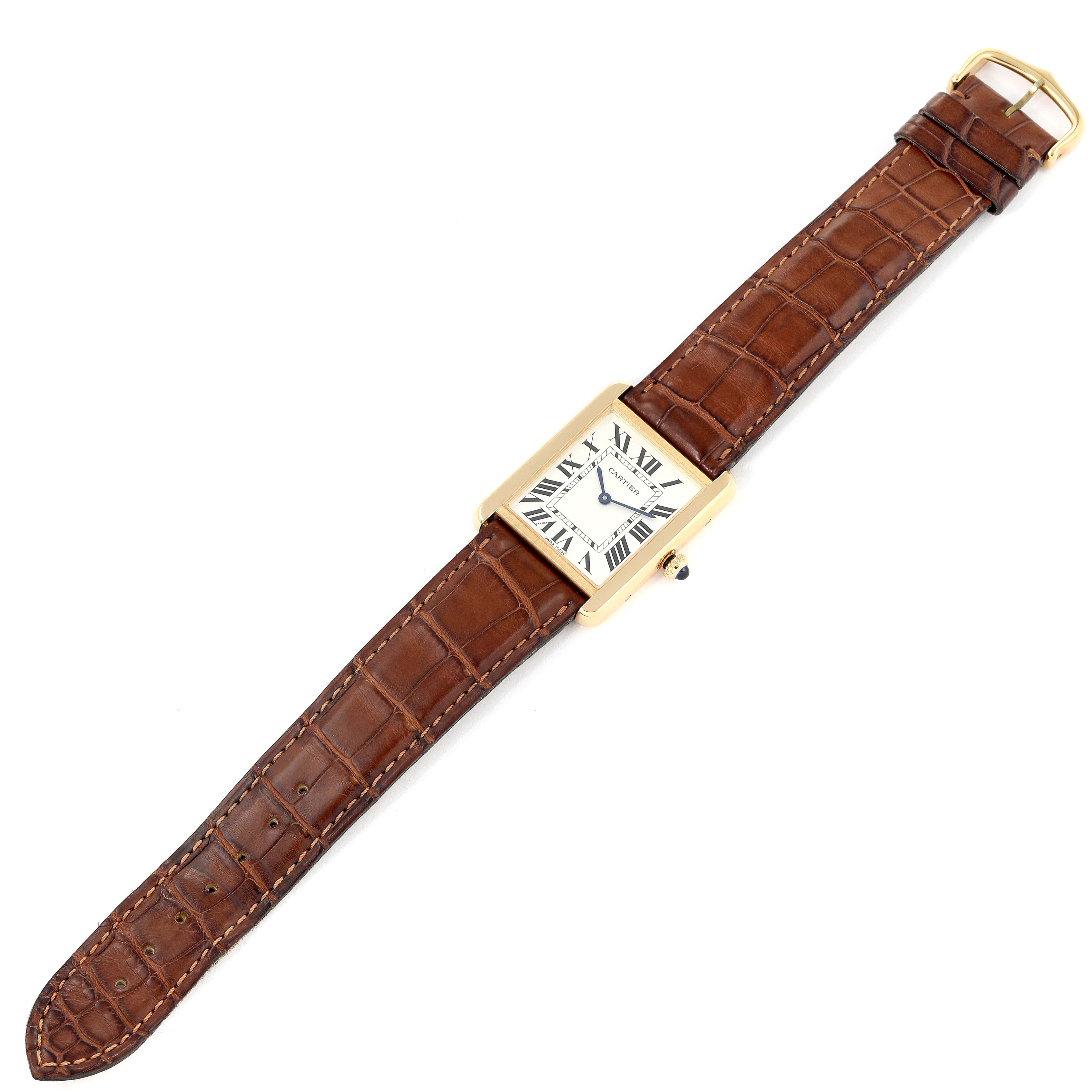 The image shows a Cartier Tank Solo W5200004 Men's Yellow Gold Silver Dial W5200004 Men's Yellow Gold Silver Dial watch with a brown leather strap viewed from a top-down angle.