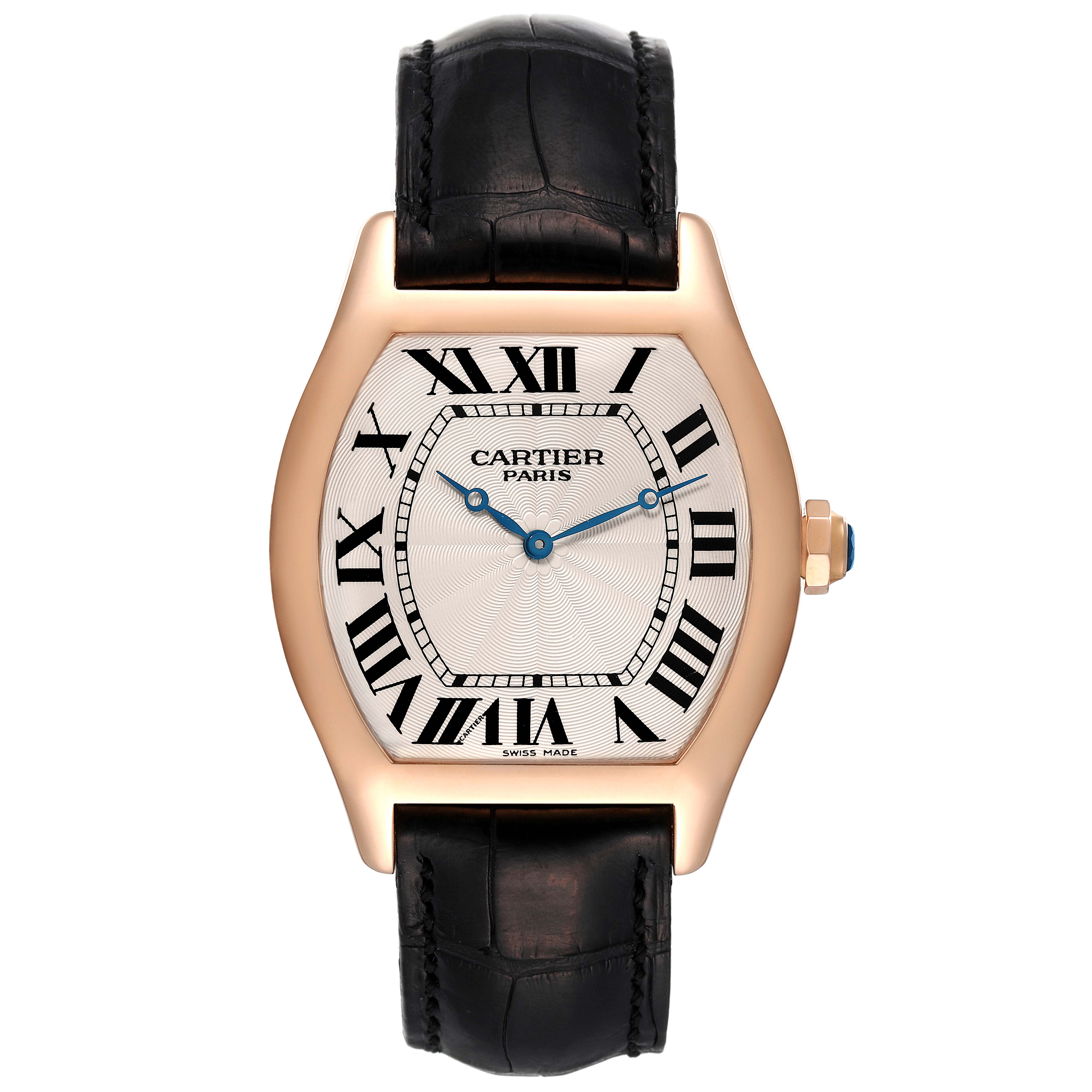 The image shows a frontal view of the Tortue model by Cartier, highlighting the watch face, strap, and crown.