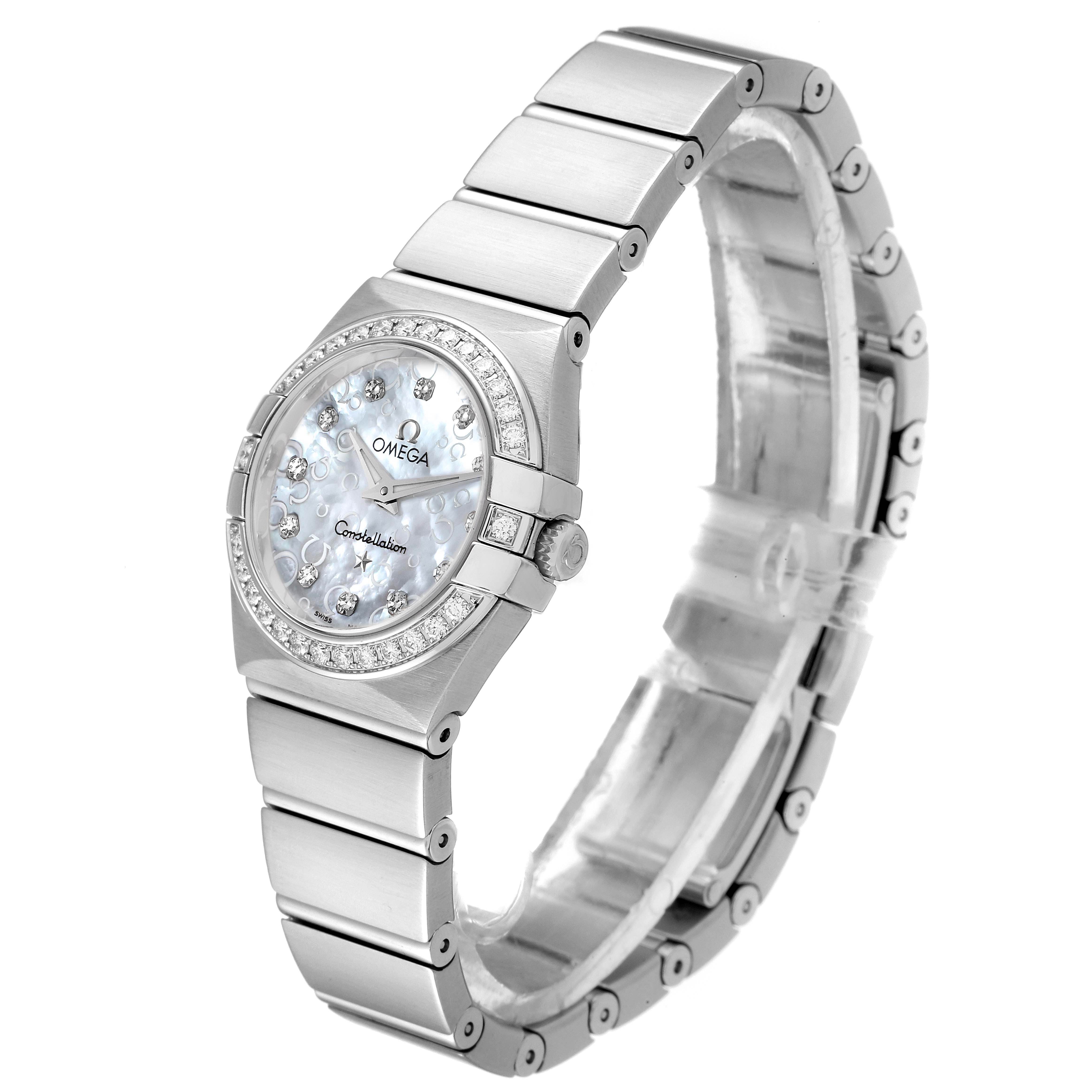 The image shows an angled view of the Omega 123.15.24.60.55.005 Women's Stainless Steel Mother of Pearl Dial 123.15.24.60.55.005 Women's Stainless Steel Mother of Pearl Dial Constellation 24mm MOP Diamond Watch, highlighting the face, bezel, and bracelet.
