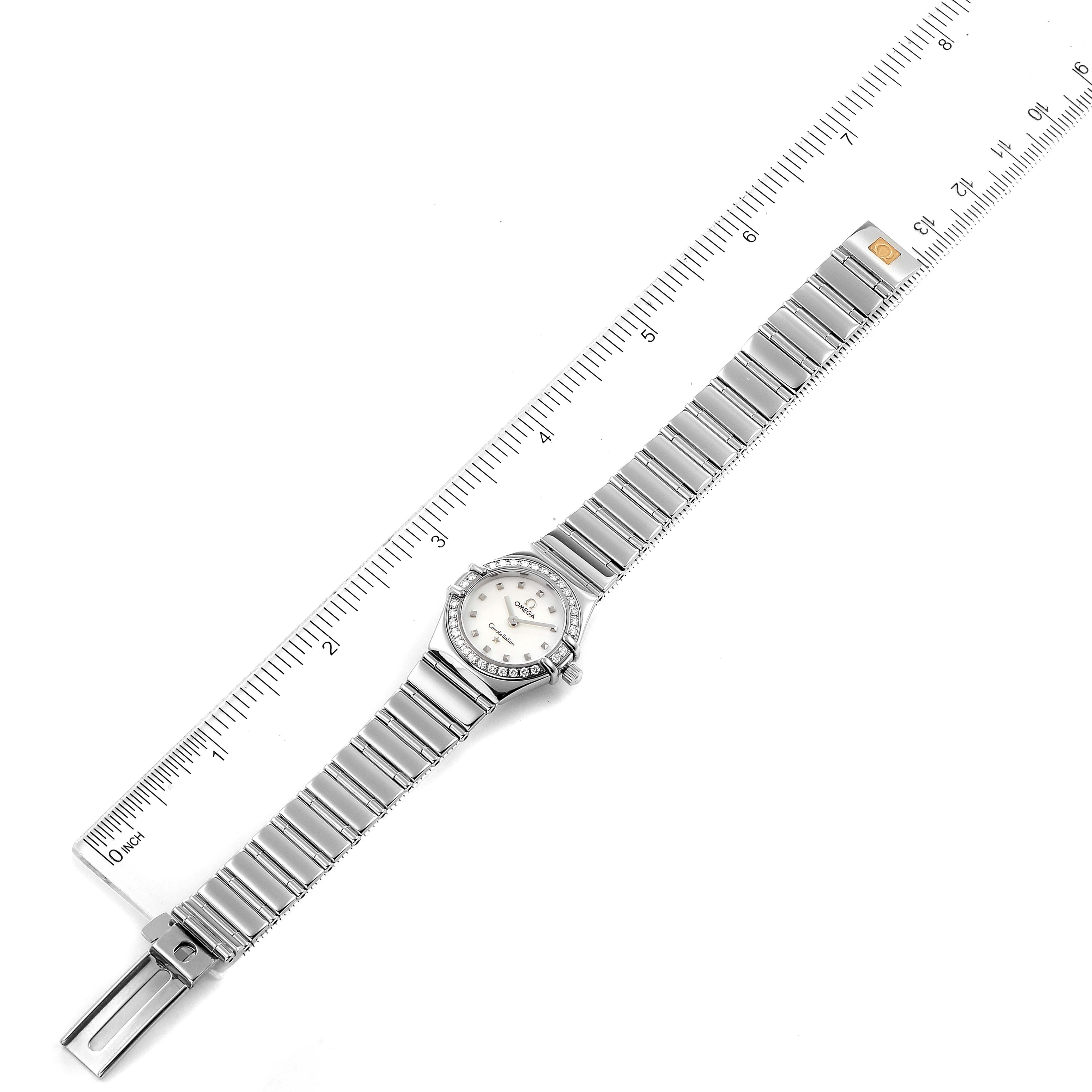 The image shows an overhead view of the Omega 1465.71.00 Women
s Stainless Steel Mother of Pearl Dial 1465.71.00 Women
s Stainless Steel Mother of Pearl Dial Constellation My Choice Diamond Steel Ladies Watch 1465.71.00 alongside a ruler.
