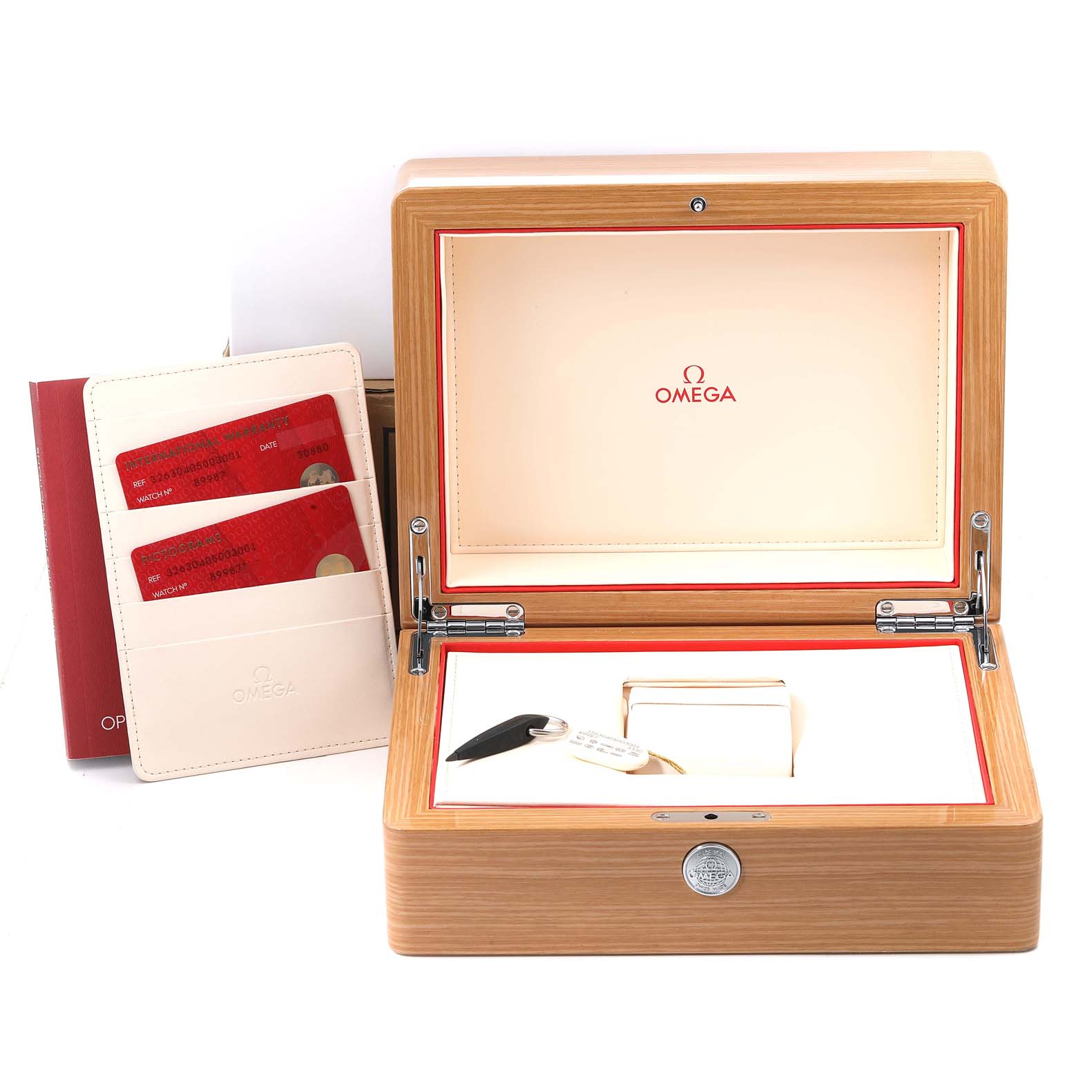 The image shows an Omega Speedmaster 326.30.40.50.03.001 Men's Stainless Steel Blue Dial 326.30.40.50.03.001 Men's Stainless Steel Blue Dial watch box with documentation, a key, and other accessories.