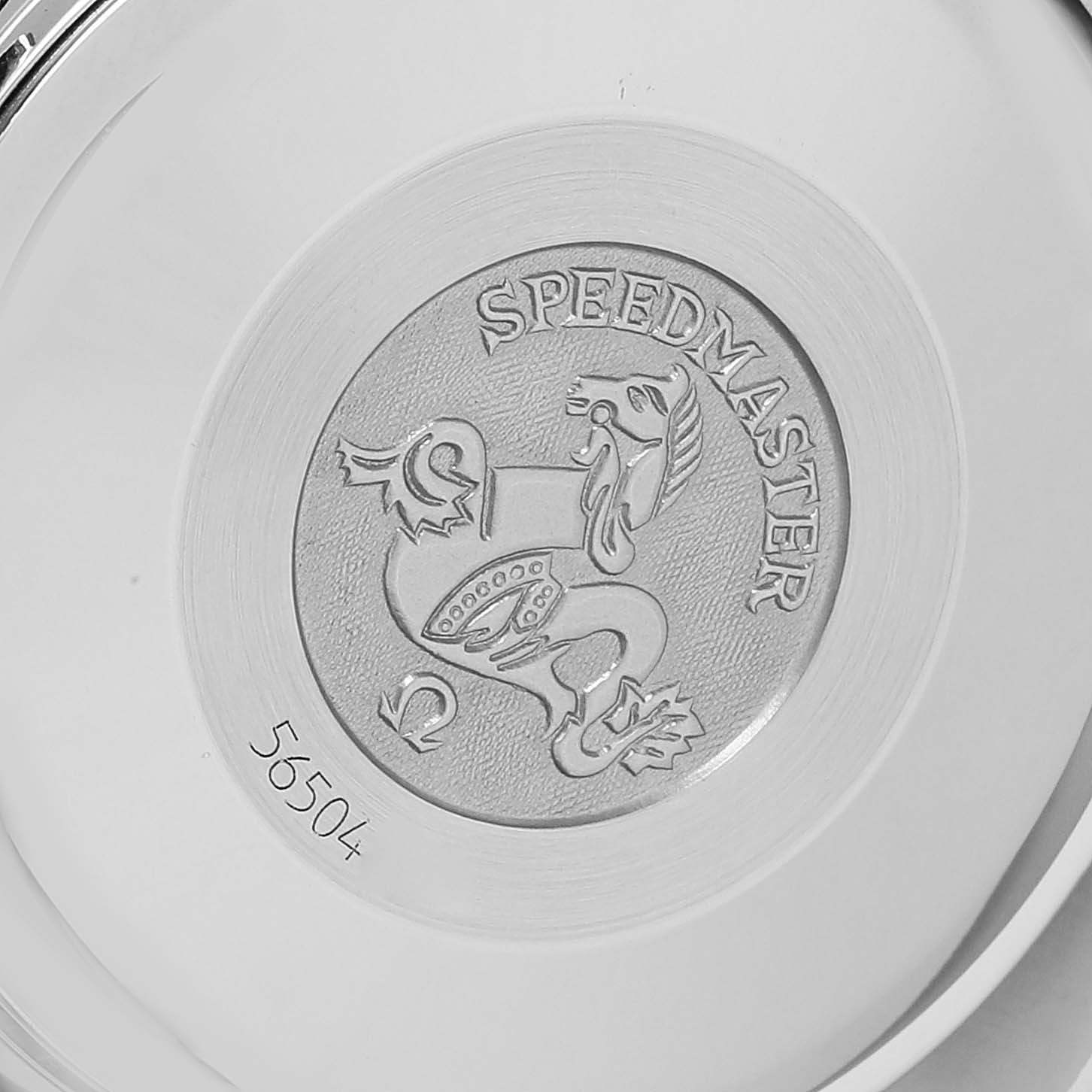 The image shows the engraved caseback of an Omega Speedmaster 3313.50.00 Men's Steel and Gold (two tone) Black Dial 3313.50.00 Men's Steel and Gold (two tone) Black Dial watch.