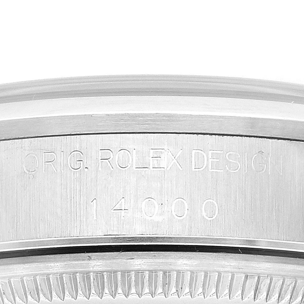 This is a close-up of the side casing of a Rolex Air-King 14000 Men's Stainless Steel Blue Dial 14000 Men's Stainless Steel Blue Dial watch, showing the "ORIG. ROLEX DESIGN" engraving.