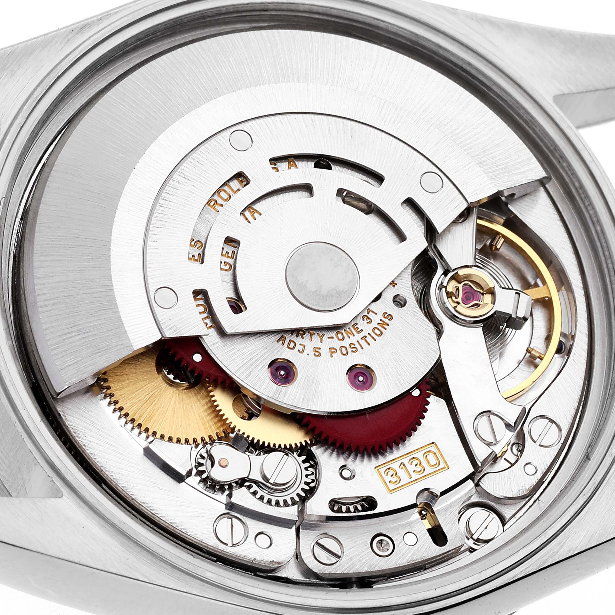 The image shows a close-up view of the movement and internal components of a Rolex Air-King 14010 Men's Stainless Steel Black Dial 14010 Men's Stainless Steel Black Dial watch, showcasing its intricate mechanics.