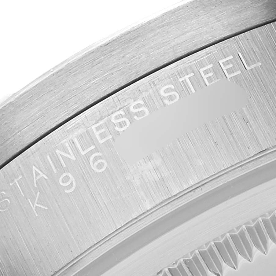This is a close-up of the case back edge of a Rolex Air-King 14010 Men's Stainless Steel Black Dial 14010 Men's Stainless Steel Black Dial, showing "STAINLESS STEEL" and part of the serial number.