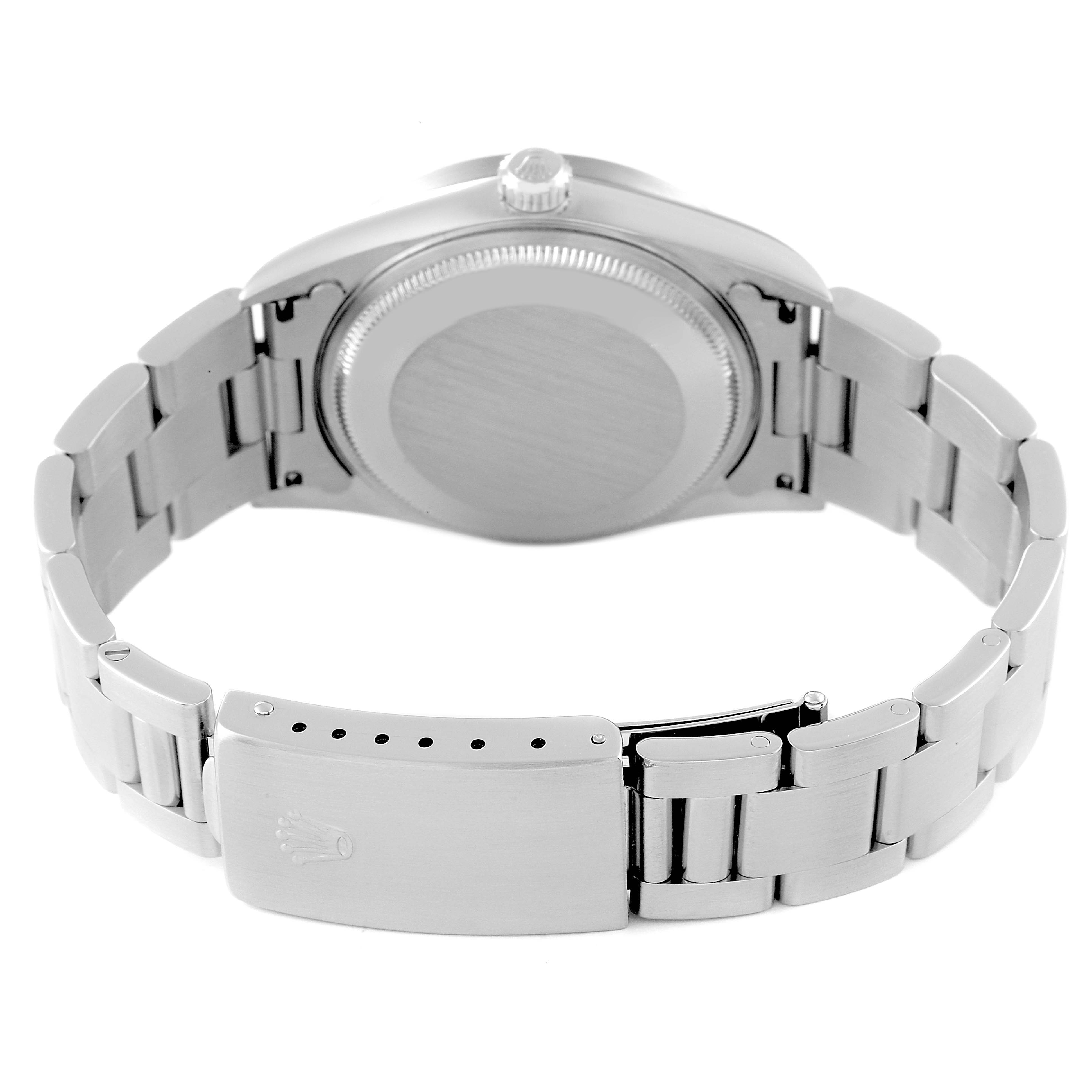The image shows the back view of a Rolex Air-King 14010 Men's Stainless Steel Silver Dial 14010 Men's Stainless Steel Silver Dial watch, highlighting its clasp, bracelet, and case back.