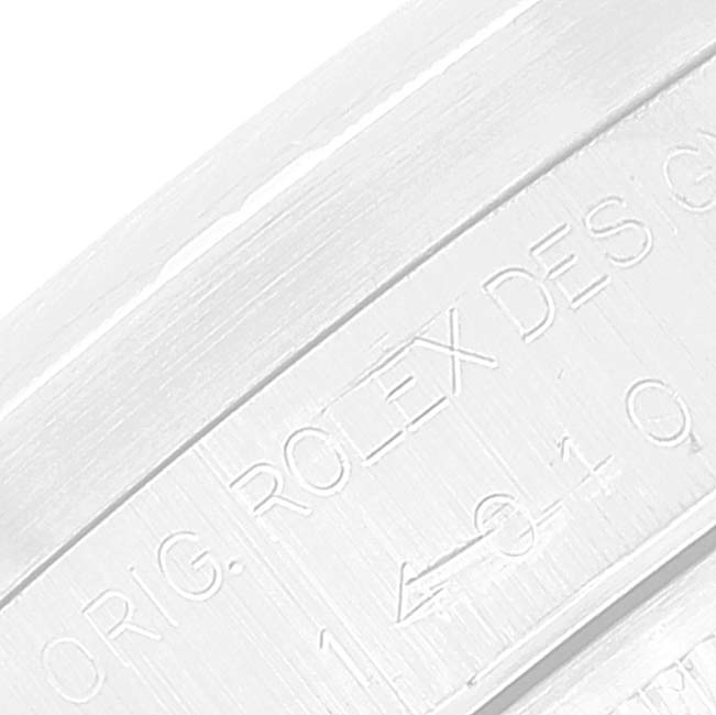 The image shows a close-up of the engraved lettering on the bezel of a Rolex Air-King 14010 Men's Stainless Steel Silver Dial 14010 Men's Stainless Steel Silver Dial watch.