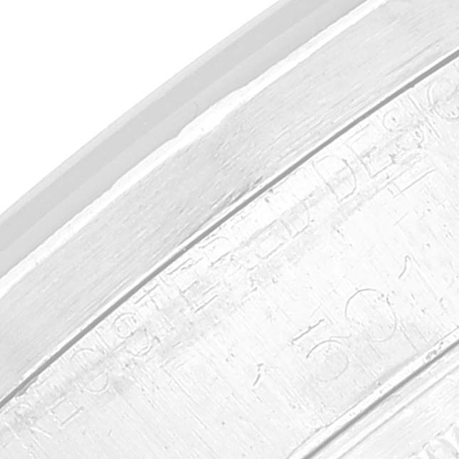 The image shows a close-up angle of the inner case, revealing the engraved serial number of the Rolex Date 1501 Men's Stainless Steel Black Dial 1501 Men's Stainless Steel Black Dial watch.