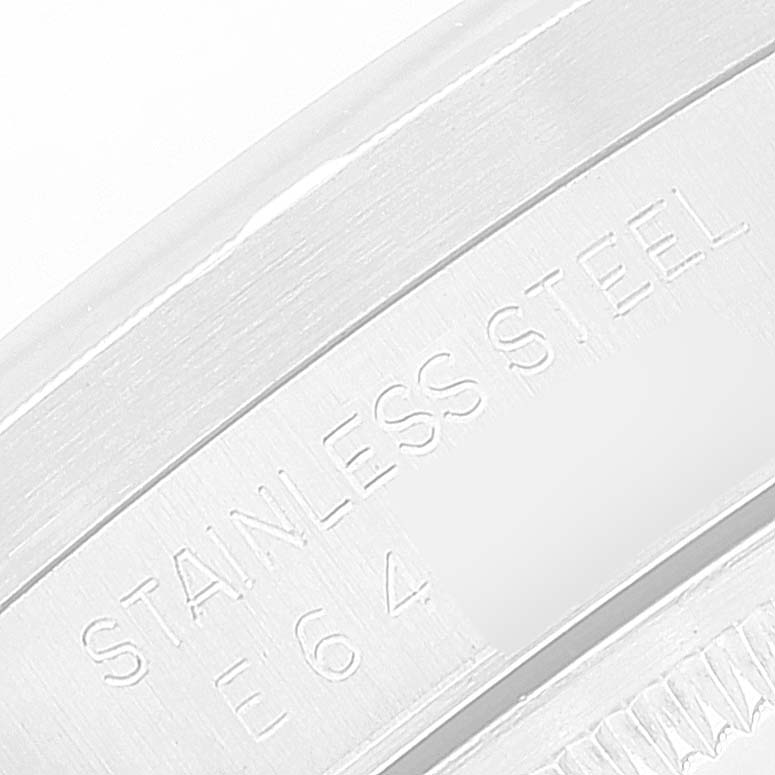 This image shows a close-up of the stainless steel engraving and part of the bezel on a Rolex Date 15210 Men
s Stainless Steel White Dial 15210 Men
s Stainless Steel White Dial model watch.