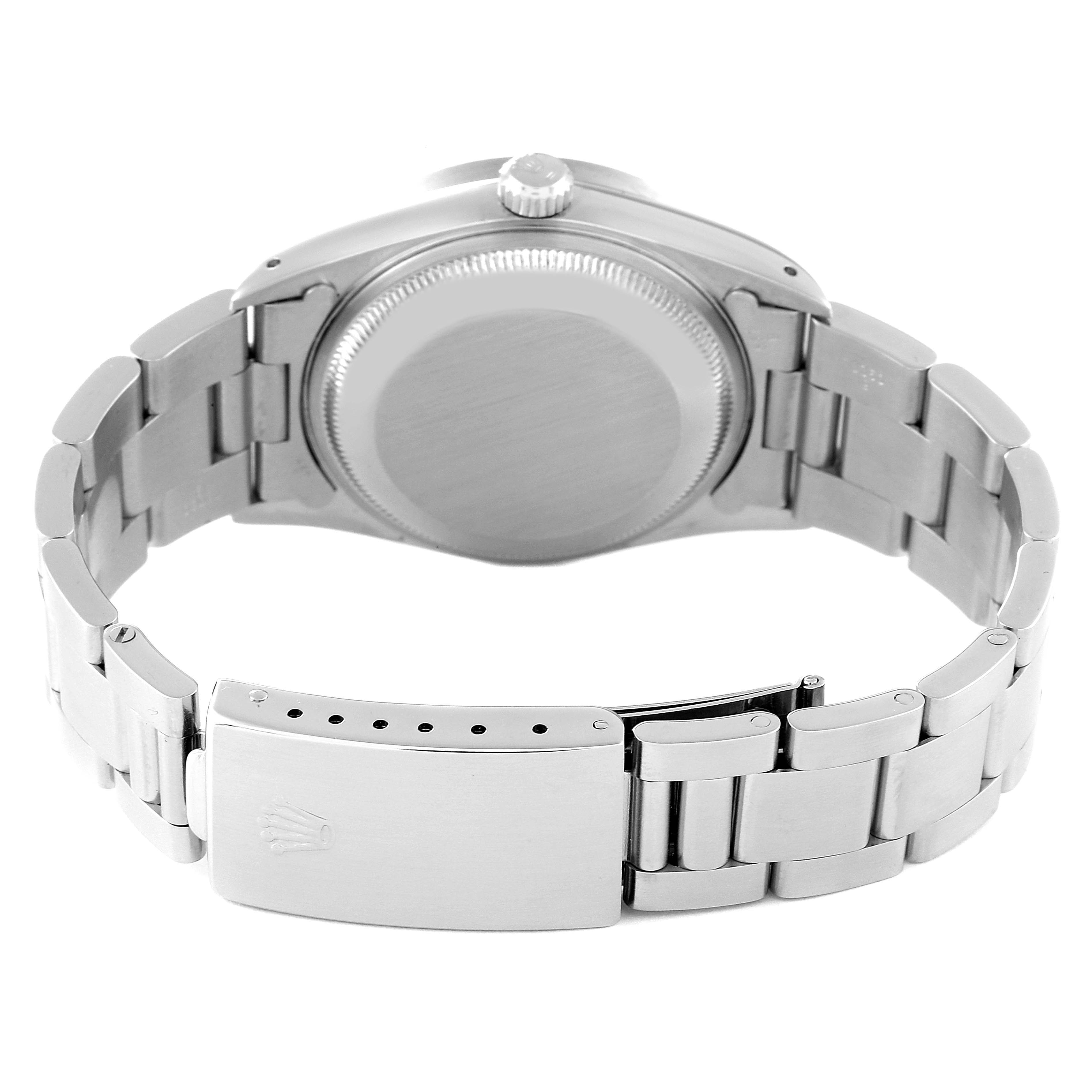 This image shows the case back, crown, and bracelet clasp of a Rolex Date 15210 Men
s Stainless Steel White Dial 15210 Men
s Stainless Steel White Dial model watch from a rear angle.