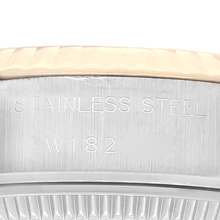 This image shows an angled close-up of the Stainless Steel casing and part of the bezel of a Rolex Datejust 69173 Women's Steel and Gold (two tone) Champagne Dial 69173 Women's Steel and Gold (two tone) Champagne Dial watch.