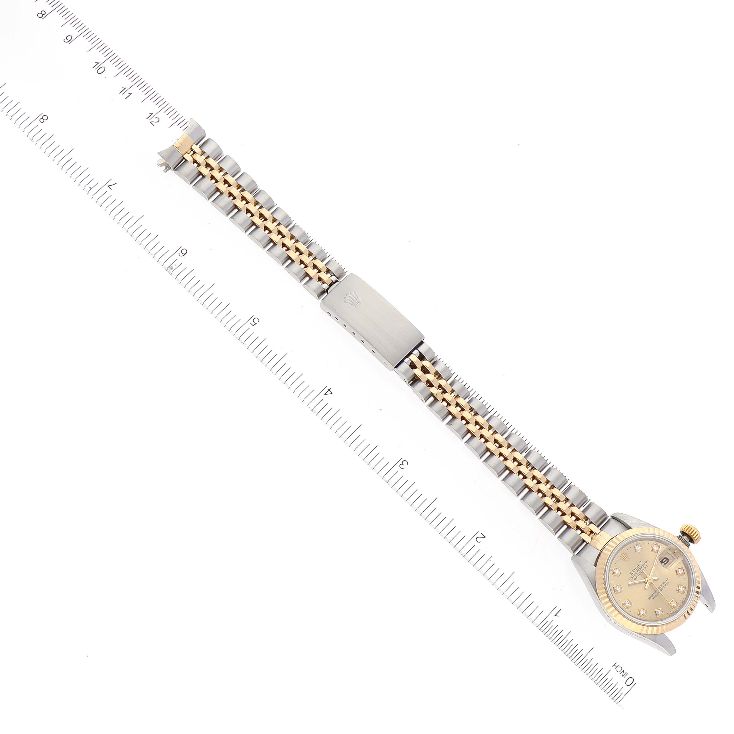 This image shows a Rolex Datejust 69173 Women's Steel and Gold (two tone) Champagne Dial 69173 Women's Steel and Gold (two tone) Champagne Dial watch laid flat, displaying the full bracelet, clasp, and face, measured against a ruler.