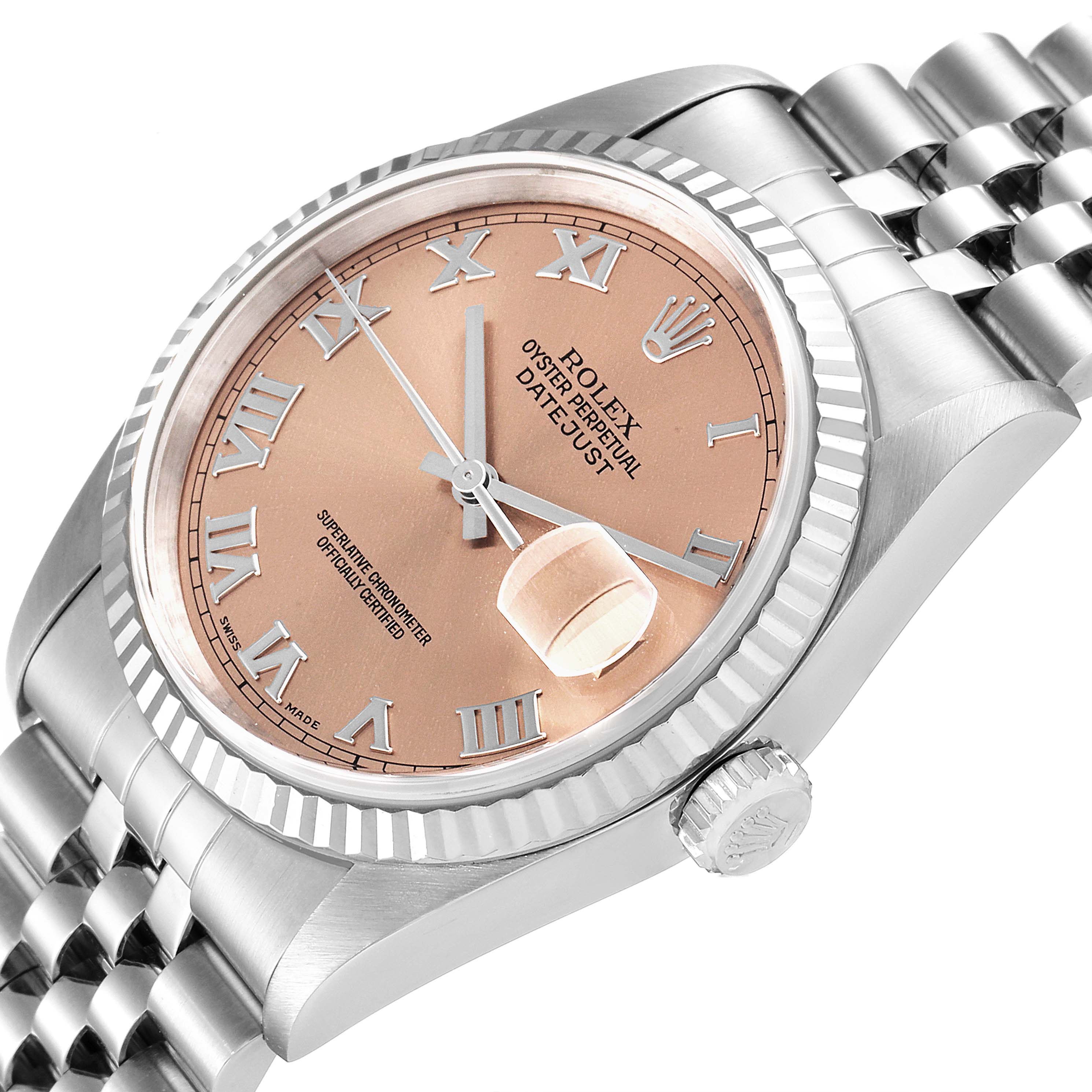 This image shows a Rolex Datejust 16234 Men
s Stainless Steel Pink Dial 16234 Men
s Stainless Steel Pink Dial watch at an angled view, highlighting its face, bezel, and part of the bracelet.