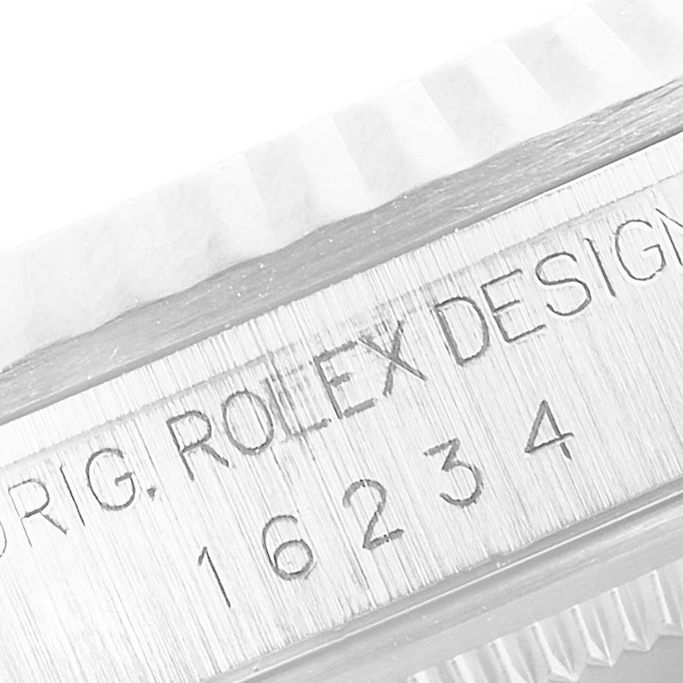 The image shows a close-up view of the case side of a Rolex Datejust 16234 Men
s Stainless Steel Pink Dial 16234 Men
s Stainless Steel Pink Dial, displaying the engraved model number "16234".