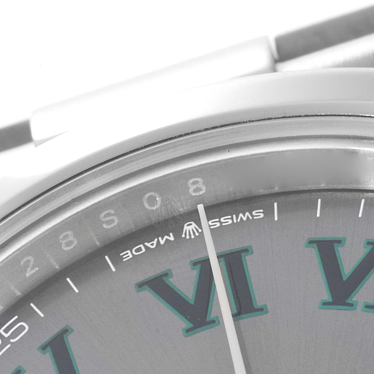 The image shows a close-up of the dial and minute hand of a Rolex Datejust 41 126300 Men's Stainless Steel Grey Dial 126300 Men's Stainless Steel Grey Dial, highlighting the "Swiss Made" text and the VI numeral.