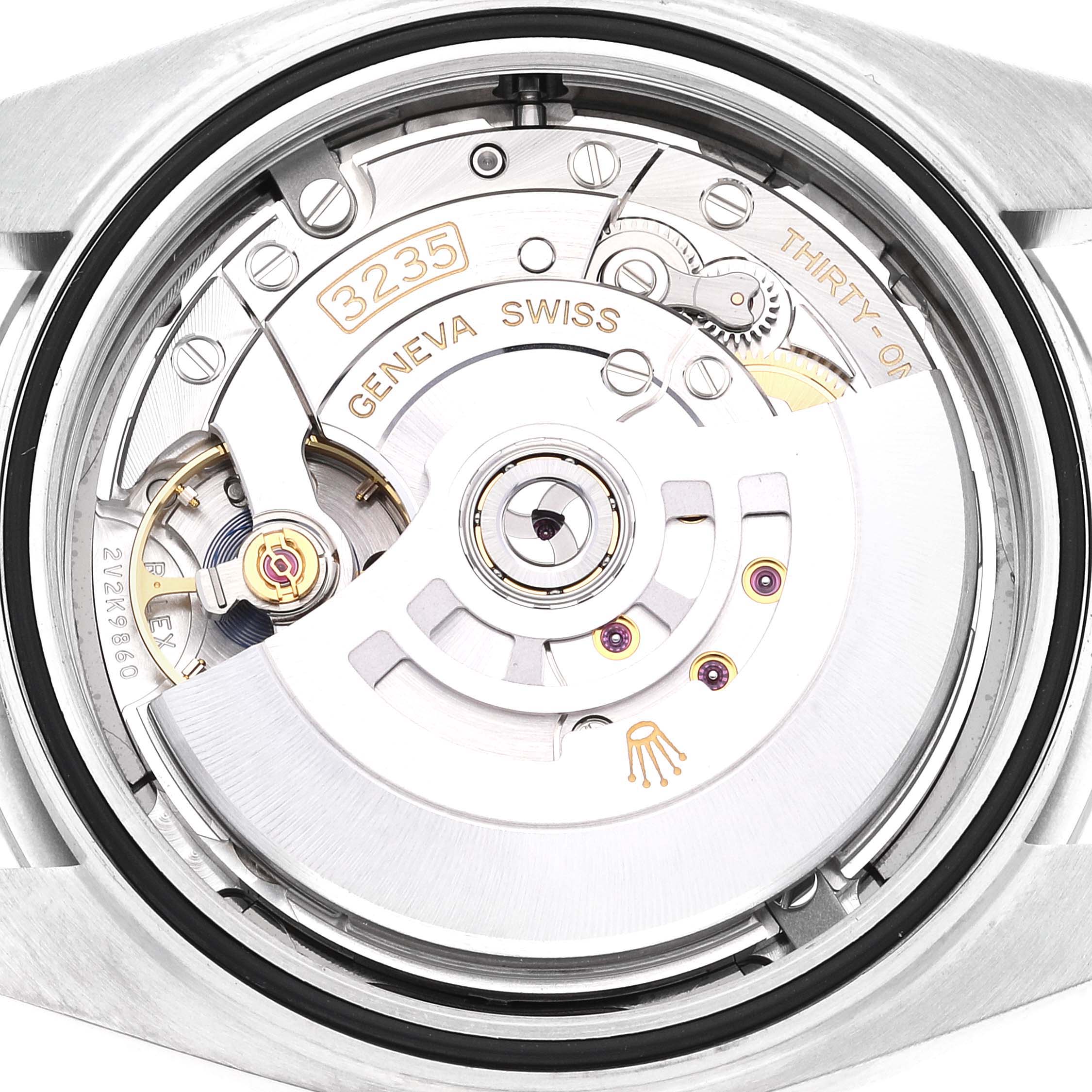 The image shows the Rolex Datejust 41 126300 Men's Stainless Steel Grey Dial 126300 Men's Stainless Steel Grey Dial's movement mechanism viewed from the back, highlighting the intricate internal components.