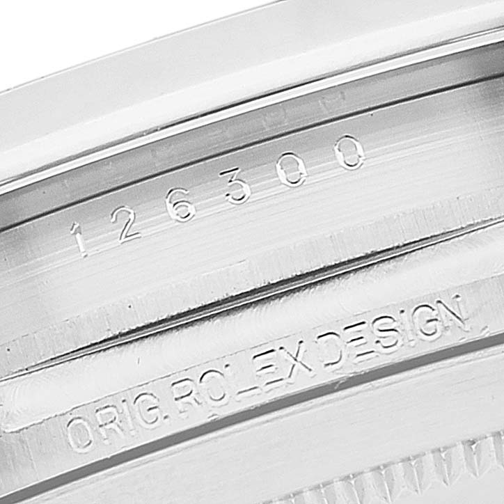 This close-up image shows the serial and model number engravings on the case of a Rolex Datejust 41 126300 Men's Stainless Steel Grey Dial 126300 Men's Stainless Steel Grey Dial watch.