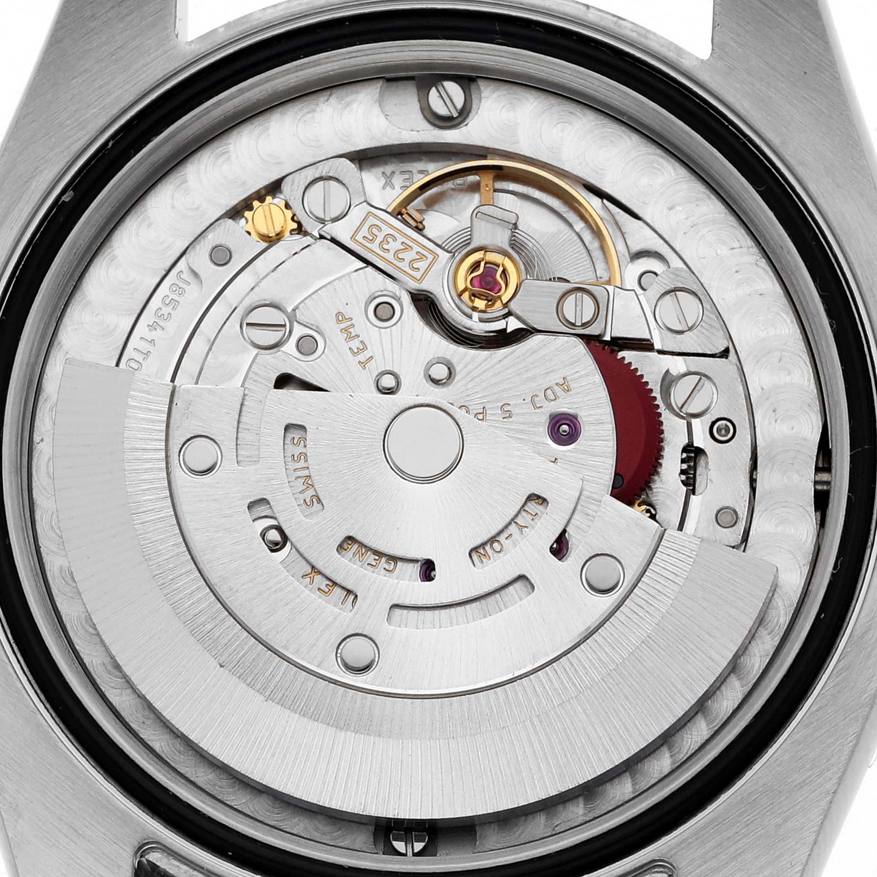 The image shows the movement of a Mid-Size Rolex watch, viewed from the back, highlighting its intricate mechanical parts.