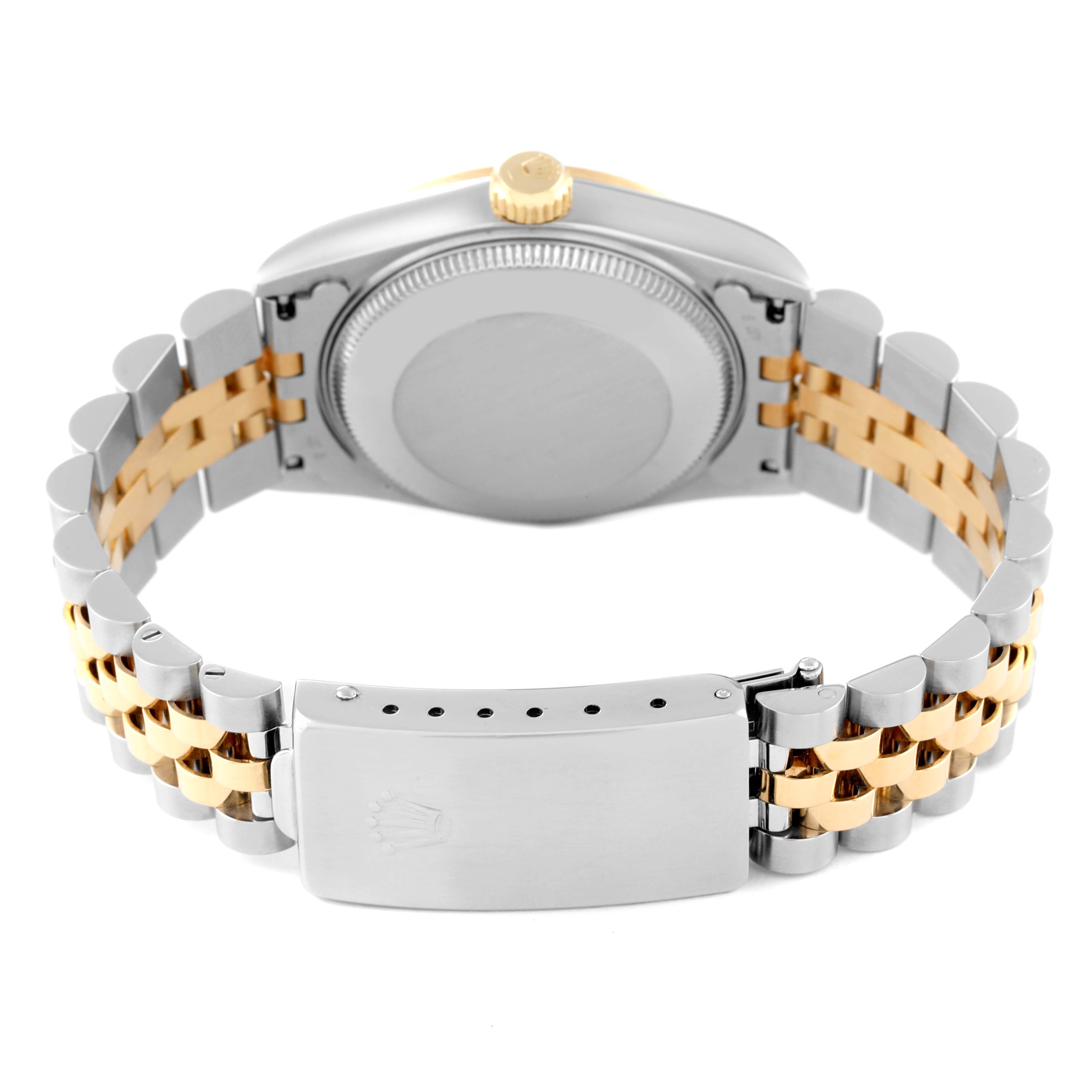 This Rolex Mid-Size 68273 Women
s Steel and Gold (two tone) White Dial 68273 Women
s Steel and Gold (two tone) White Dial watch is shown from the back, highlighting the case back, crown, and two-tone bracelet clasp.