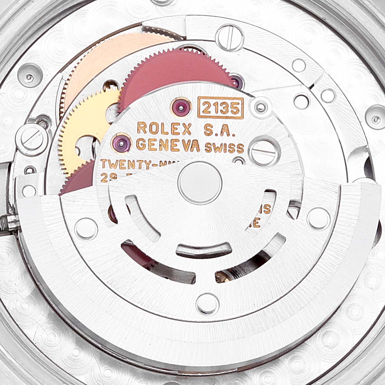 This close-up image shows the internal mechanism of a Rolex Mid-Size 68273 Women
s Steel and Gold (two tone) White Dial 68273 Women
s Steel and Gold (two tone) White Dial model watch, highlighting gears and inscriptions.